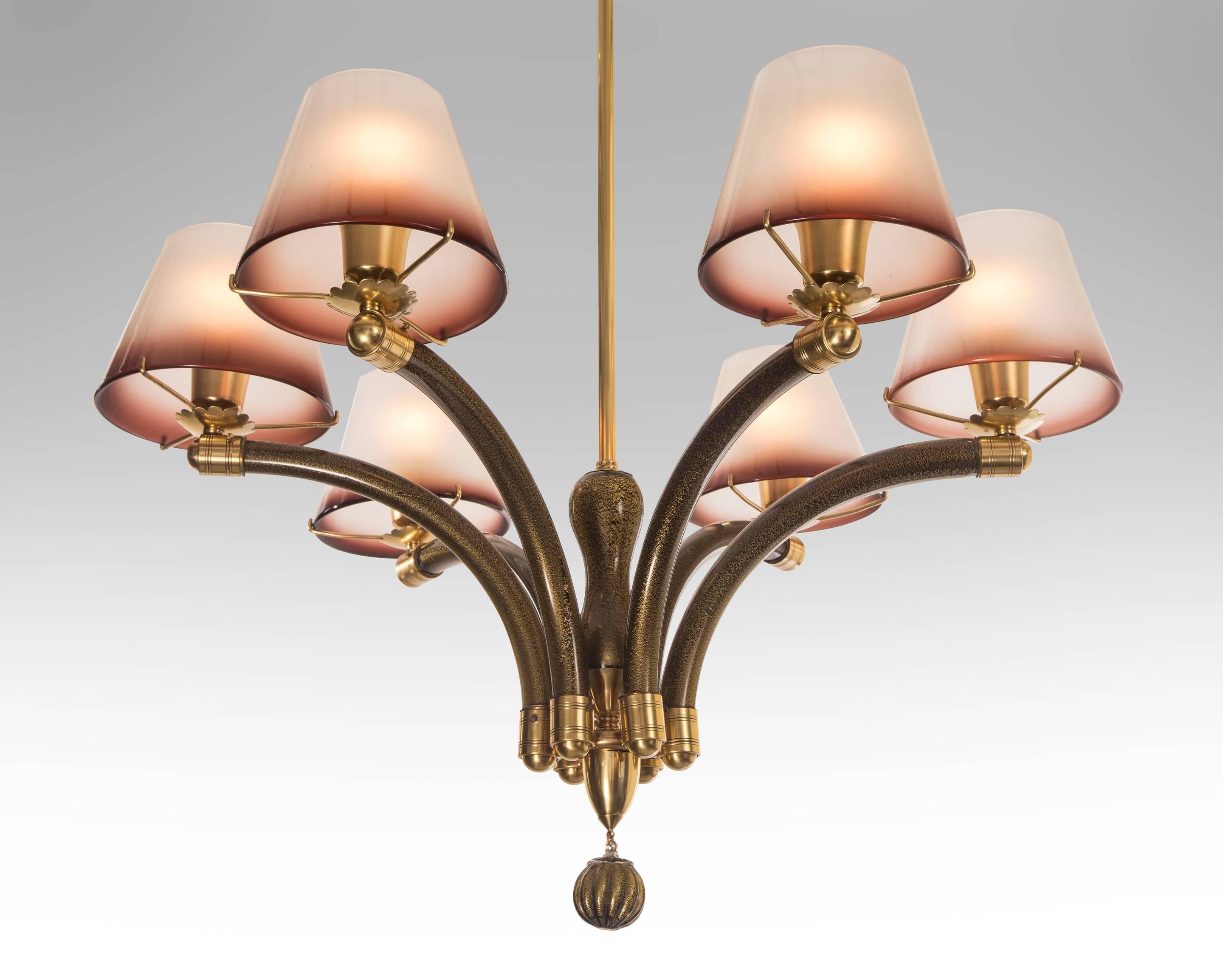 Fratelli Toso, Rare Murano Glass and Brass Six Arm Chandelier
The gold-speckled dark amethyst glass canopy, above hanging rod issuing six gold-speckled dark amethyst arcing arms, each arm holding a single light and conical glass diffuser,