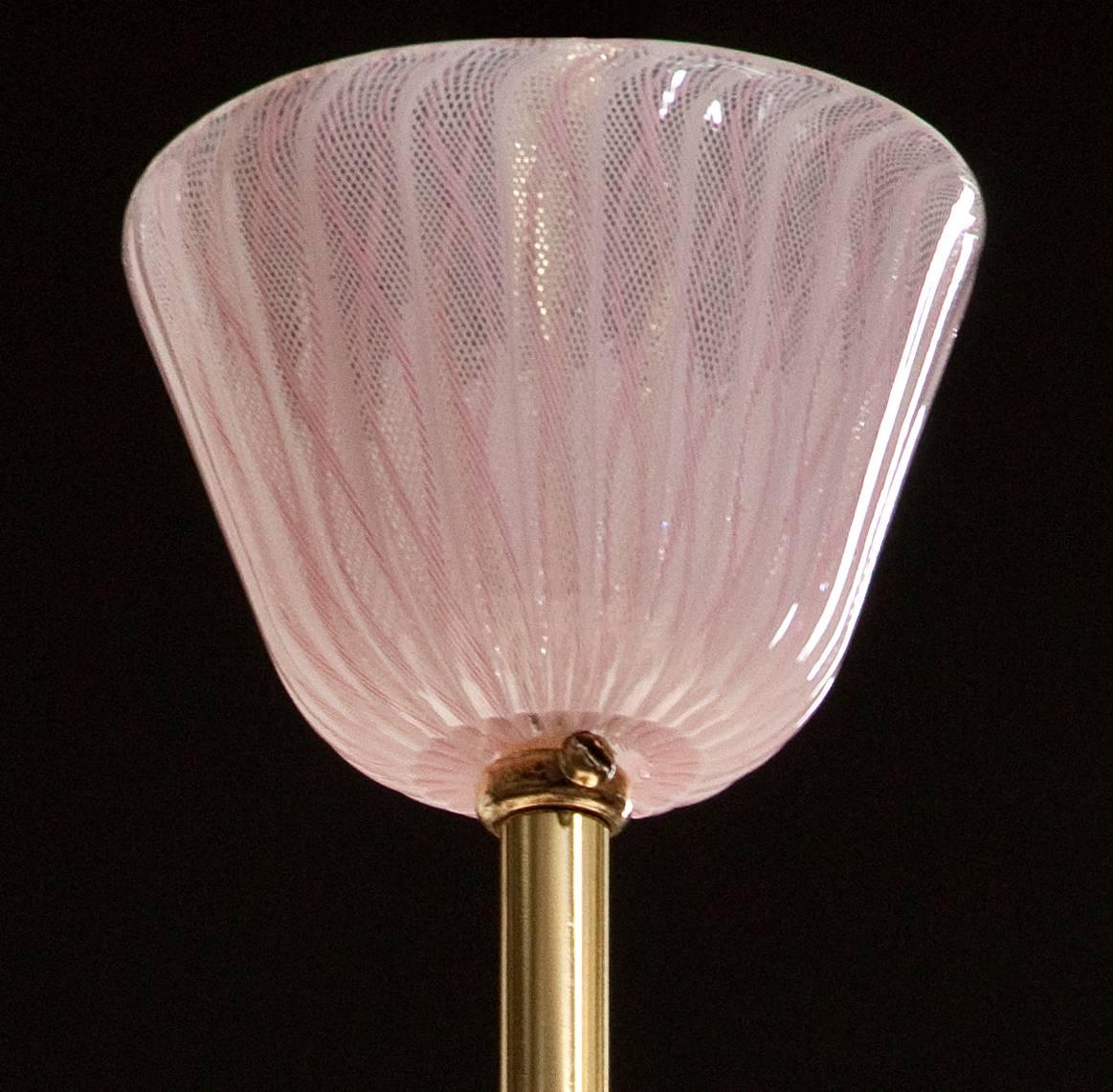 The conforming glass canopy, above a hanging rod, centering an ovoid pink filigrana glass diffuser.
The height can easily be adjusted. 
Overall height: 42.25