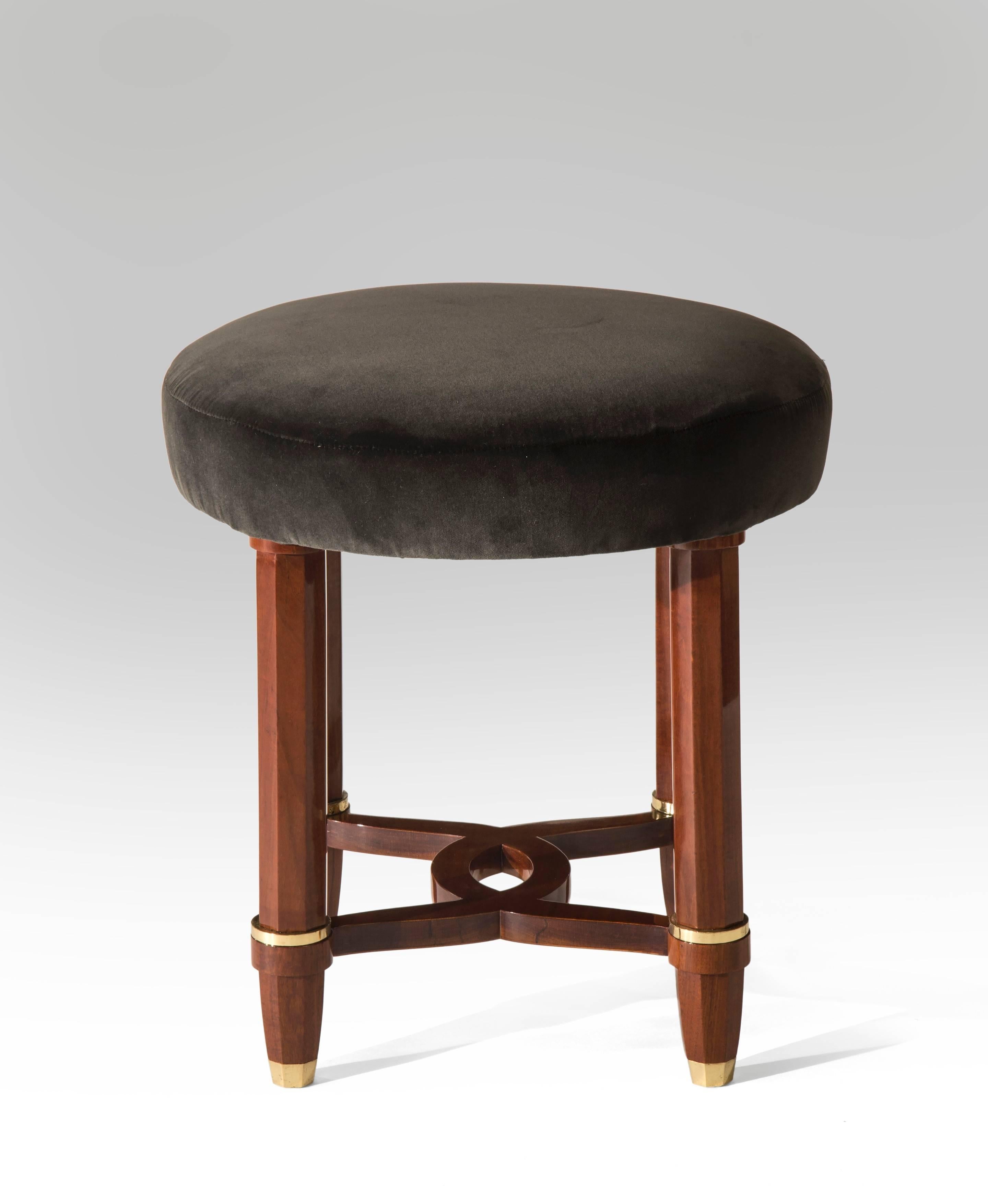 Sumptuous, finely detailed and of the highest quality. The circular upholstered seat, above octagonal legs joined by a looped stretcher, terminating in gilt bronze sabots. 

A matching desk also available.