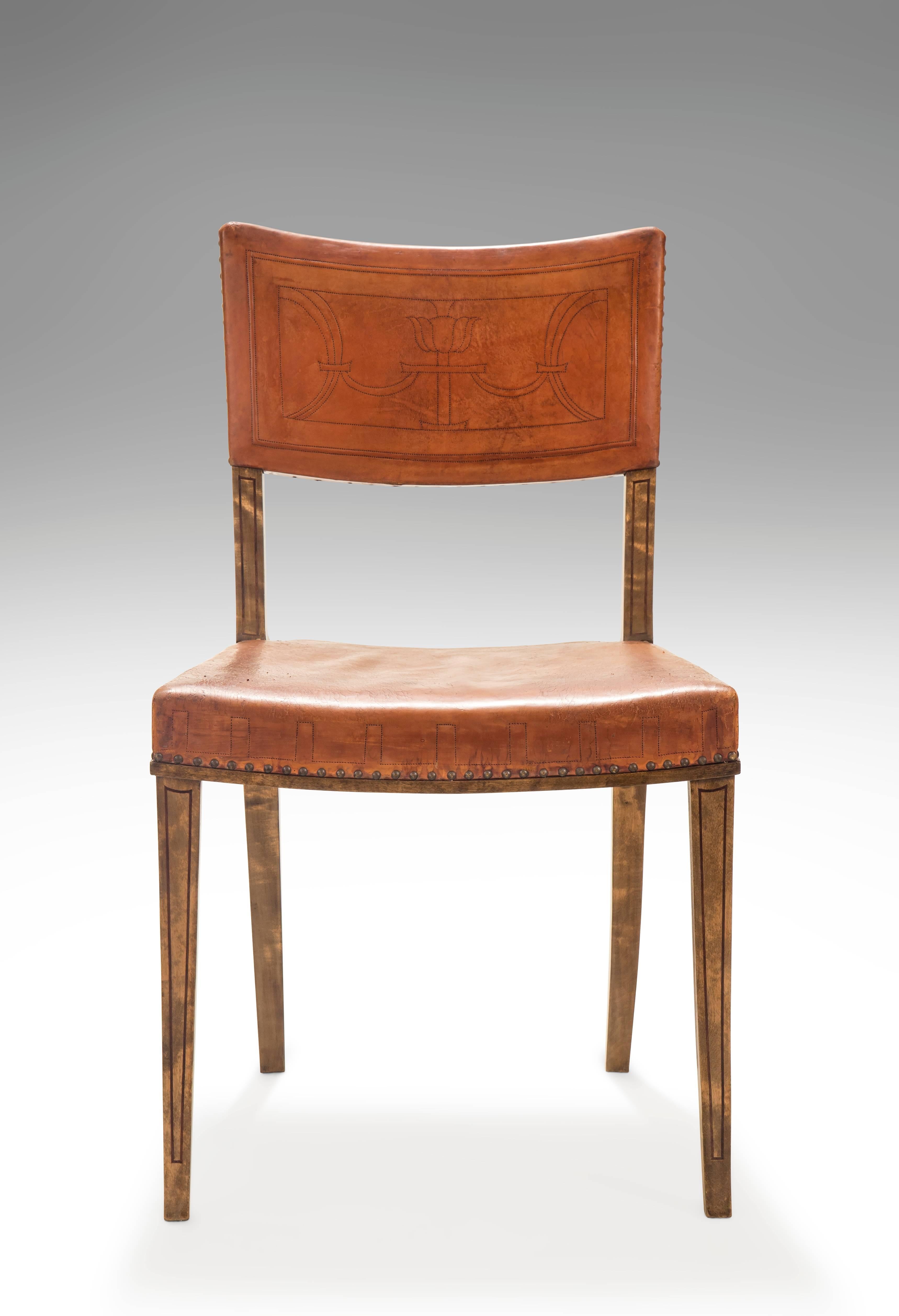 Graceful, elegant and even better comfortable. Each with an upholstered vintage cognac leather back centering an embossed classical design, over a trapezoidal seat with a Greek key patterned leather, on four purple heart inlaid saber legs.

Related