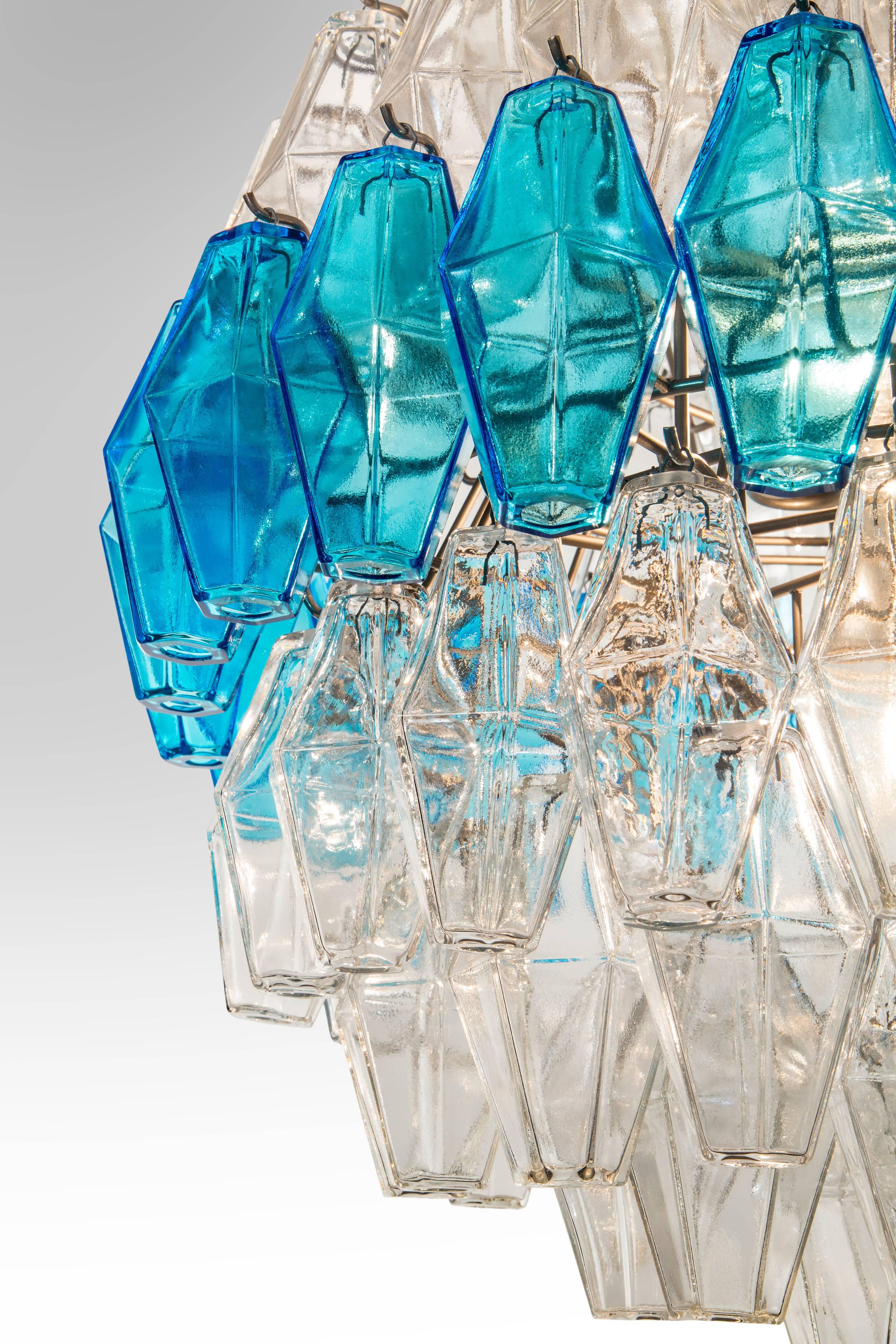 A rare spherical example of beautiful colorless and blue glass. Composed of ten tiers of polyhedral-shaped glass pendants, all colorless except the center tier.