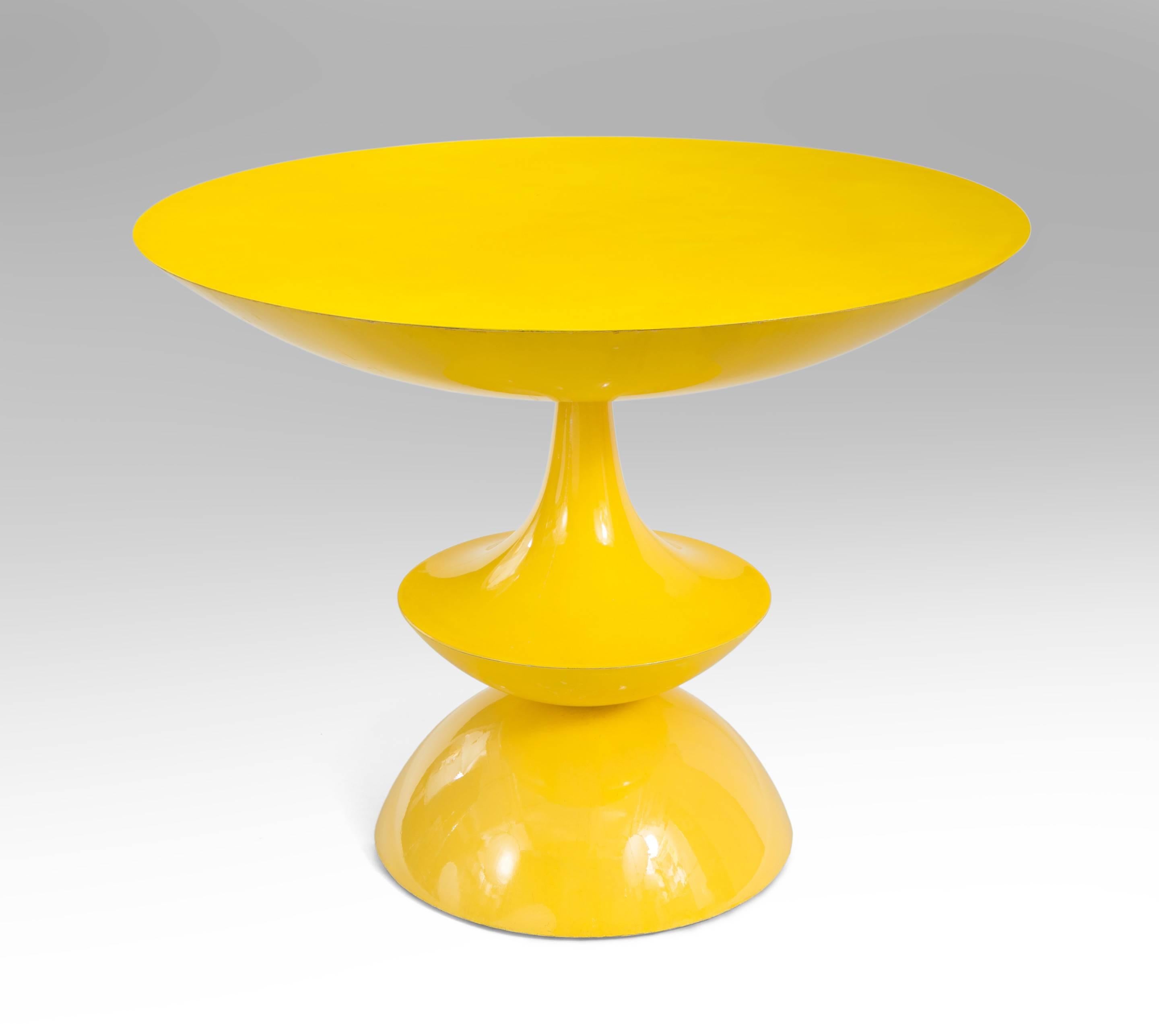 The circular top, above a shaped pedestal, terminating in a circular base. 

An identical table is in the collection of the Centre Georges Pompidou in Paris. 