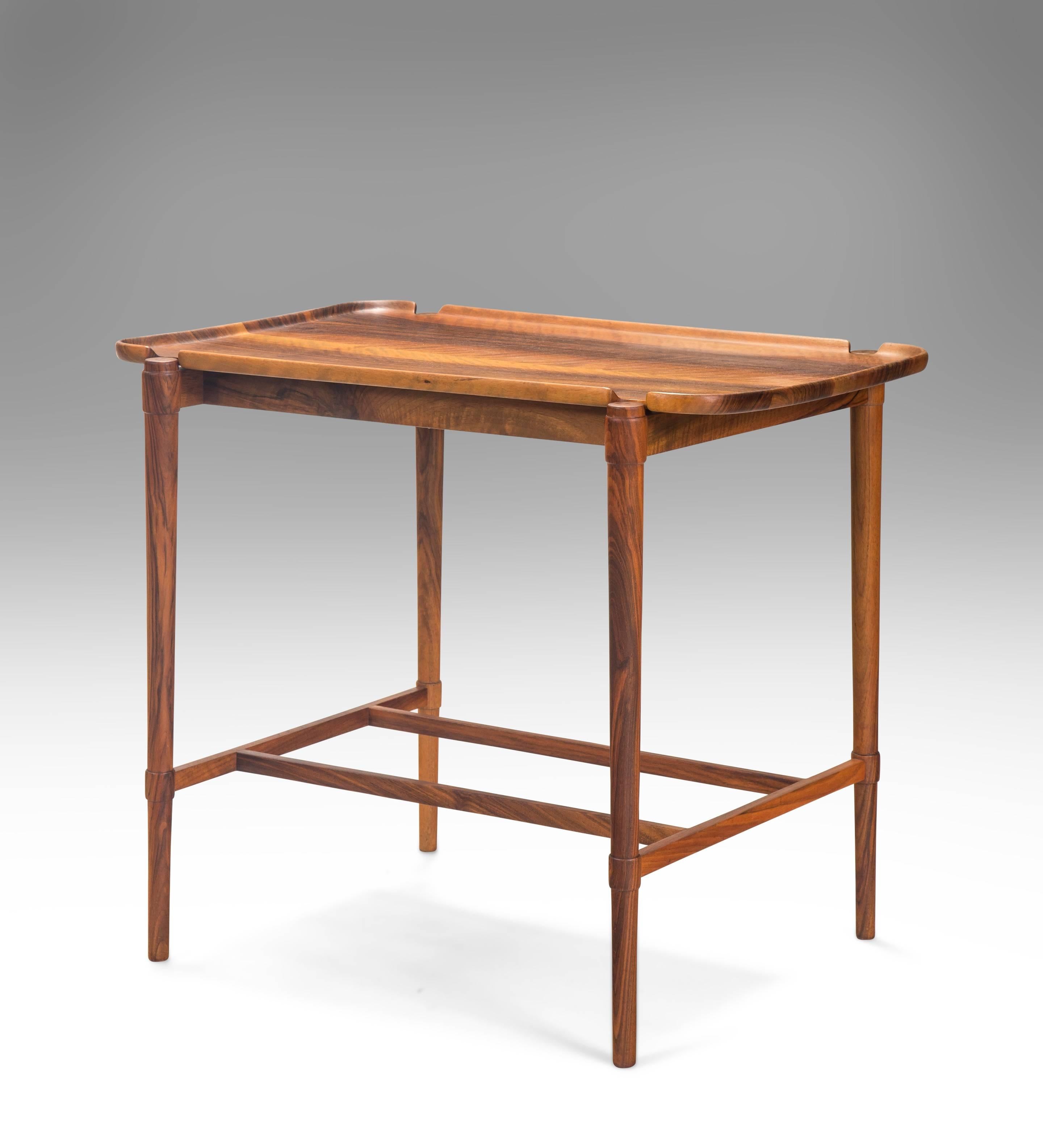 A Rare Early Solid Walnut Tray-top Table, With Production Stamp Number 1

Very likely the first example of this handsome model produced. Elegantly crafted with sumptuously figured walnut throughout. The rectangular tray top with rounded corners,