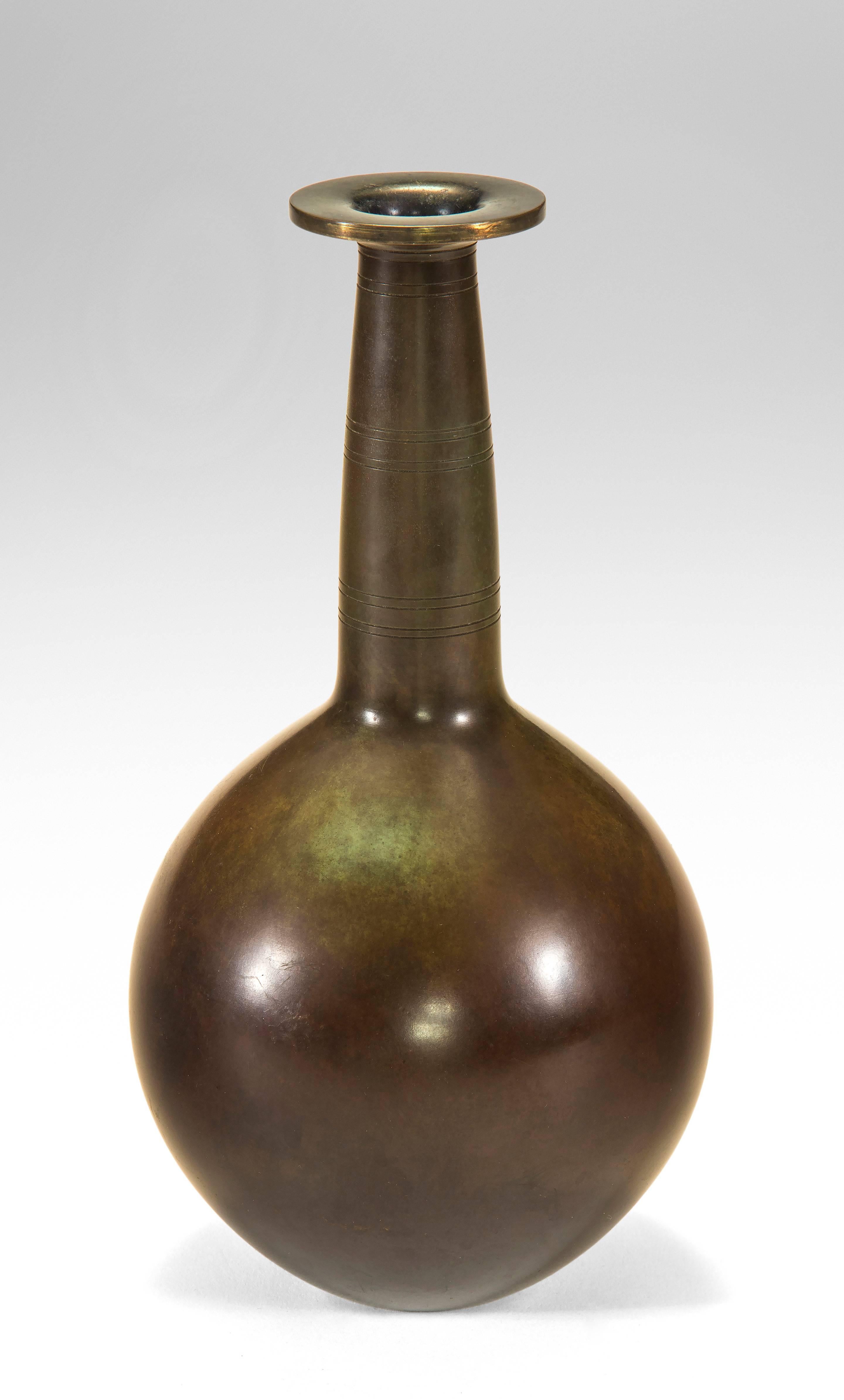 Each with a rich brown and green patination. The elongated neck, above a spherical body. Marked: Just Danmark B2367