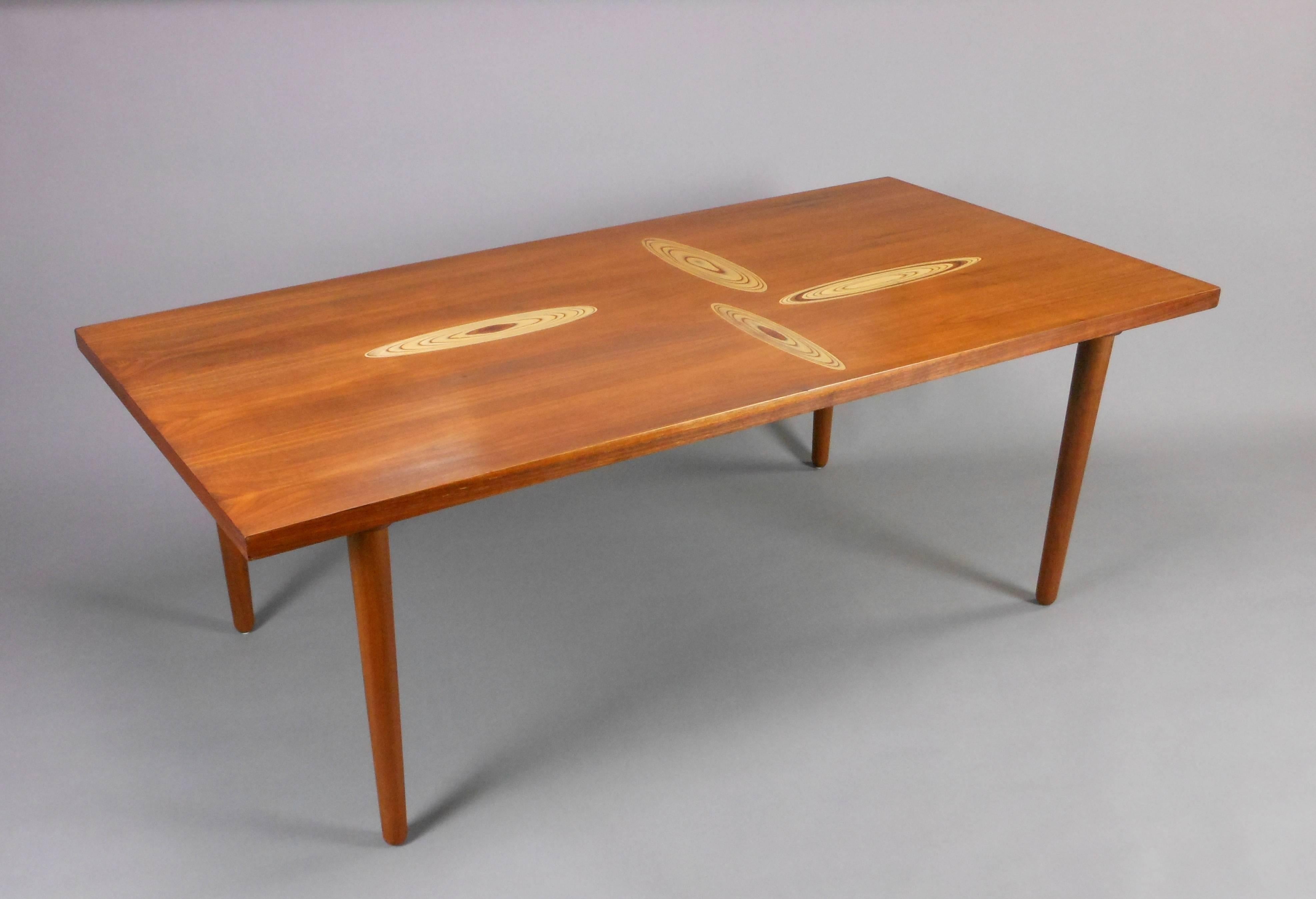 The rectangular top inlaid with elliptical crosscuts. Stamped on the underside : TAPIO WIRKKALA  ASKO MADE IN FINLAND
