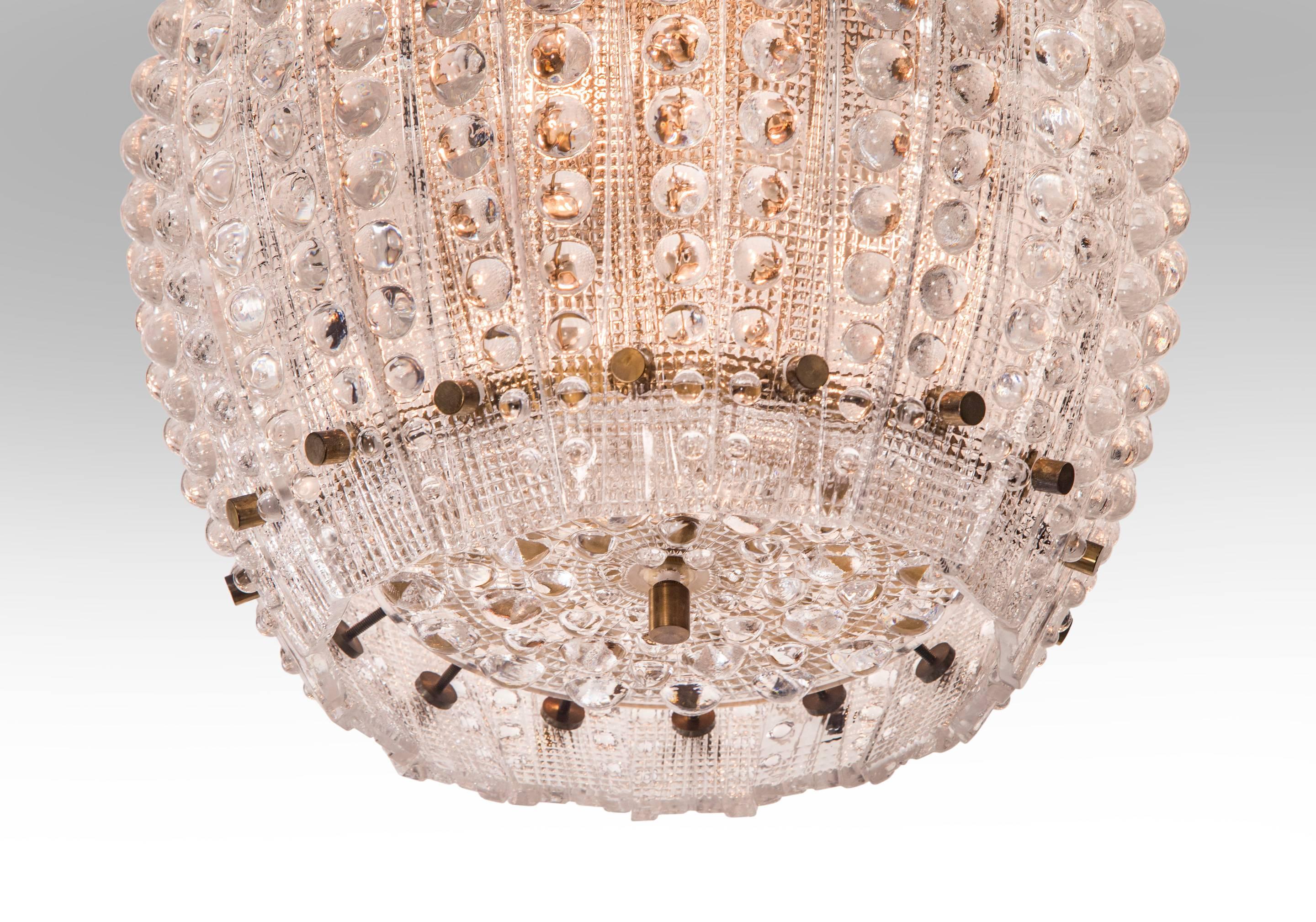 Carl Fagerlund for Orrefors, Brass Fastened Studded Glass Chandelier In Good Condition In New York, NY