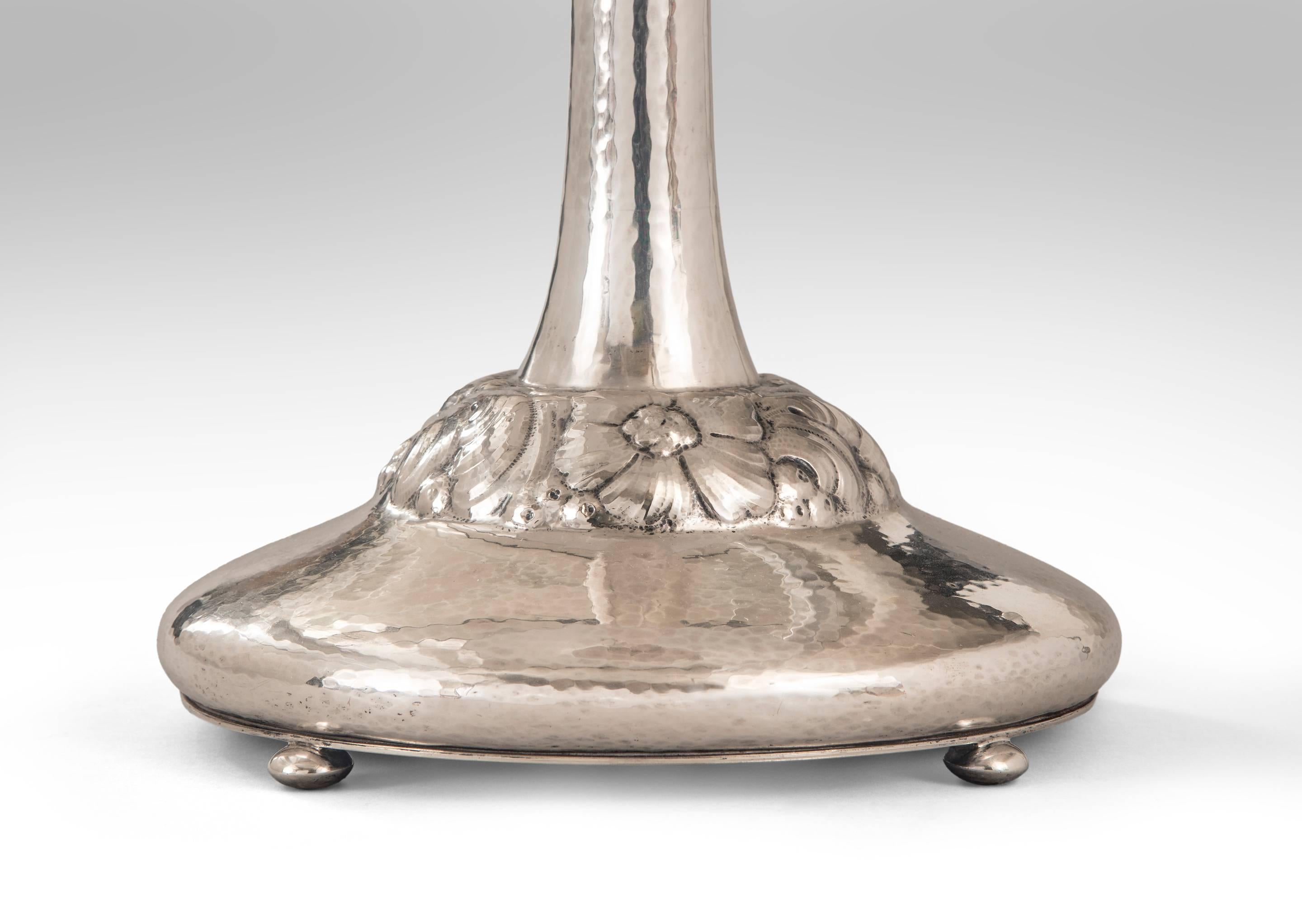 Good scale and finely detailed silver. The tapering standard terminating in a low relief floral and foliate domed base. Hallmarked: C.G. Hallberg S Y7