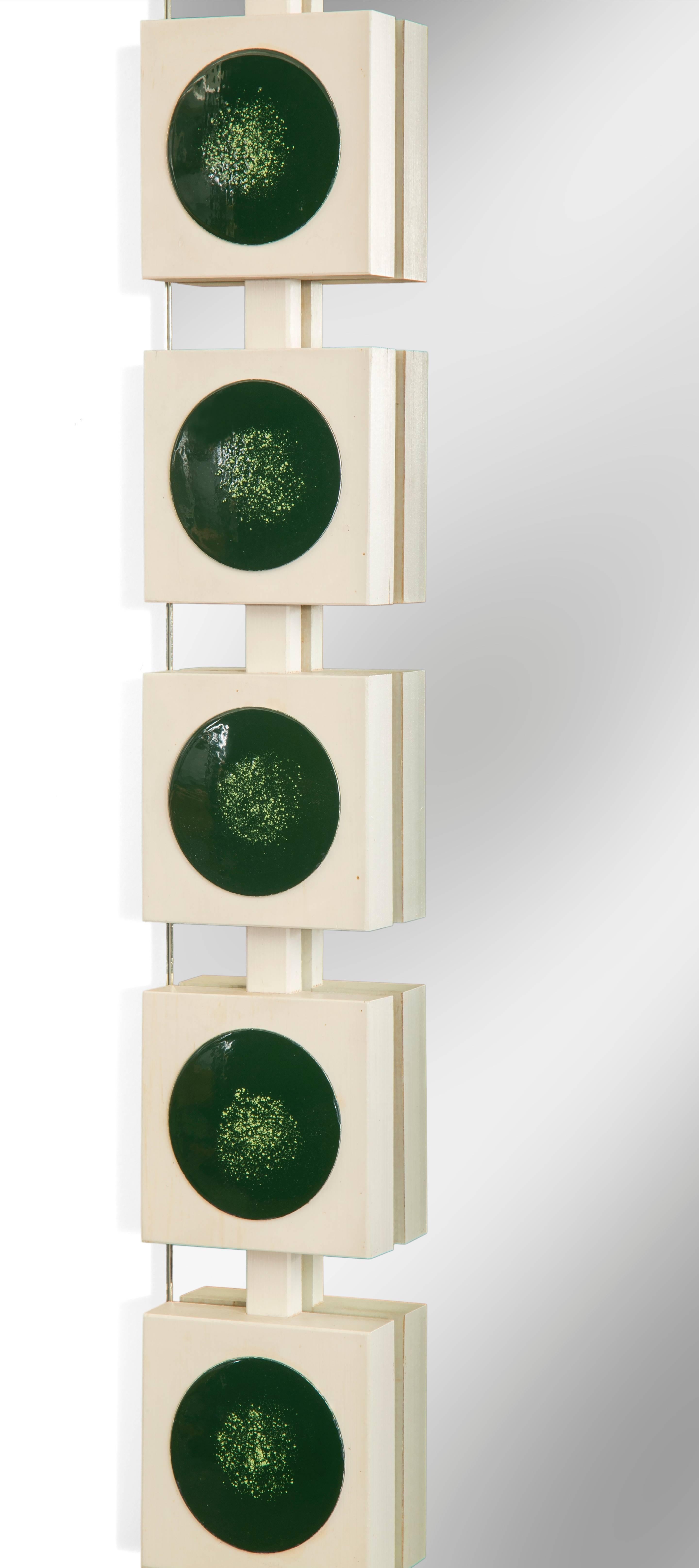 Circles and squares, enamel and painted wood, simple and complex, beautiful mirror. 
The rectangular mirror plate framed by a series of ebonized wooden blocks inlaid with enamel discs. LaBELed:   AB GLAS & TRÄ (G&T) Nr. GT 7090

In great