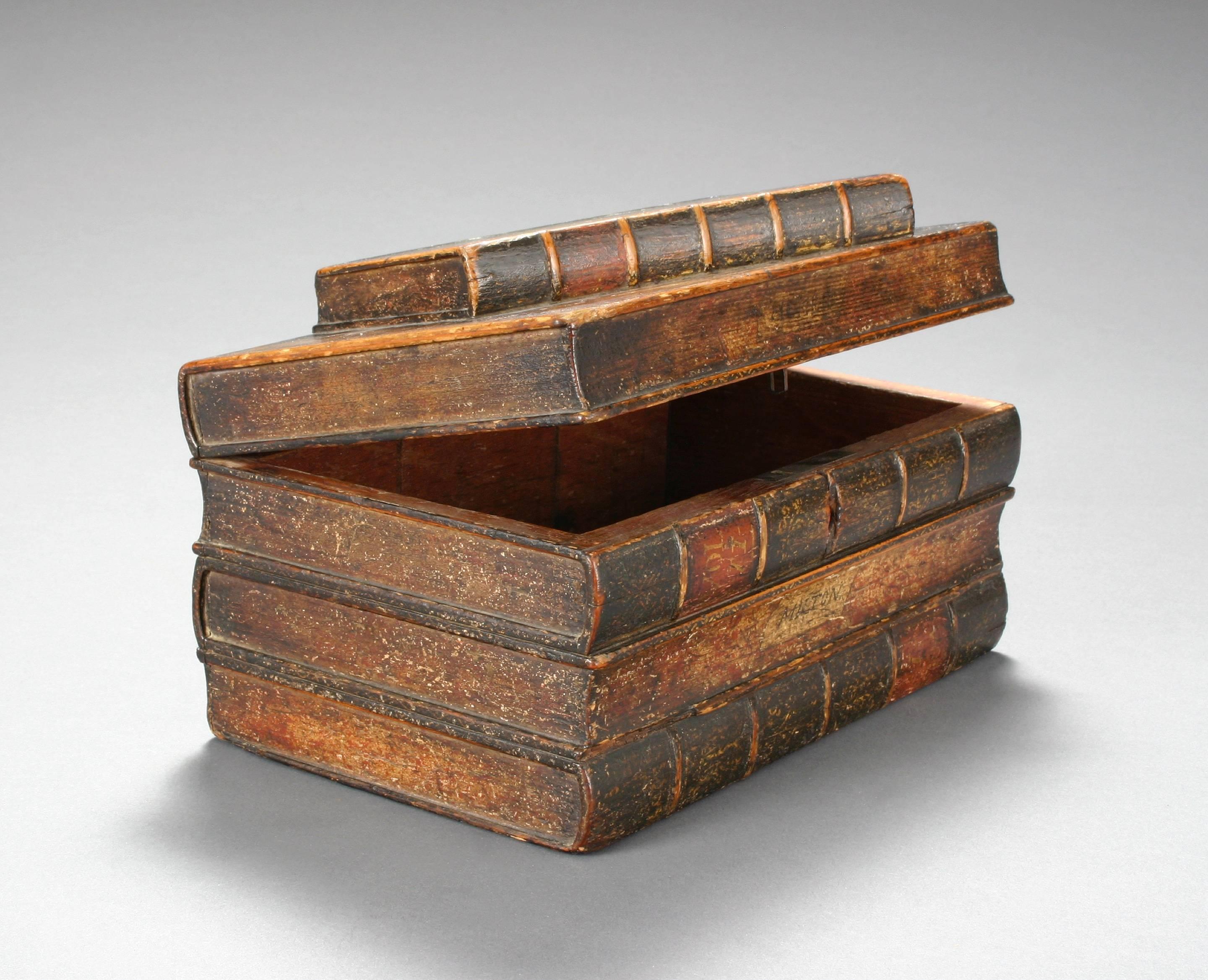 Delightful, clever tromp l'oeil box created to resemble a stack of old books.

Illustrated, Antiquities and Collecting magazine, Book Form Furniture, June 2008, p. 39.

Wonderful mellow antique condition with lovely aged patina, ready to add to your