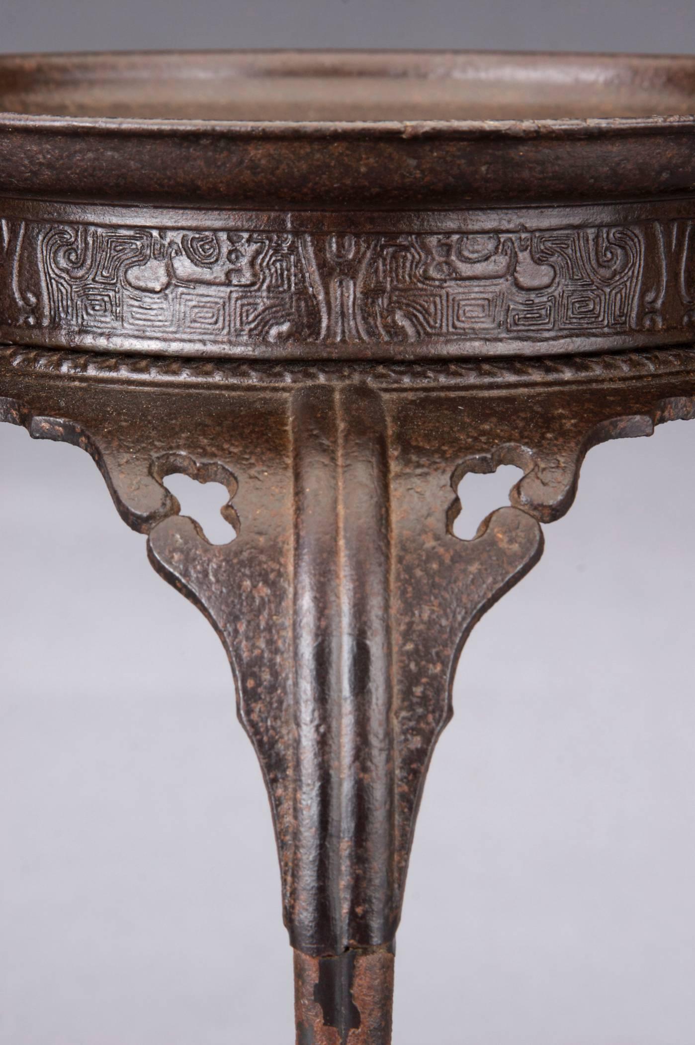 Outstanding quality and beautifully detailed. The circular dish with archaic frieze resting on the four leg stand with scrolled spandrels pierced by cloud openings, ending in scrolled feet.