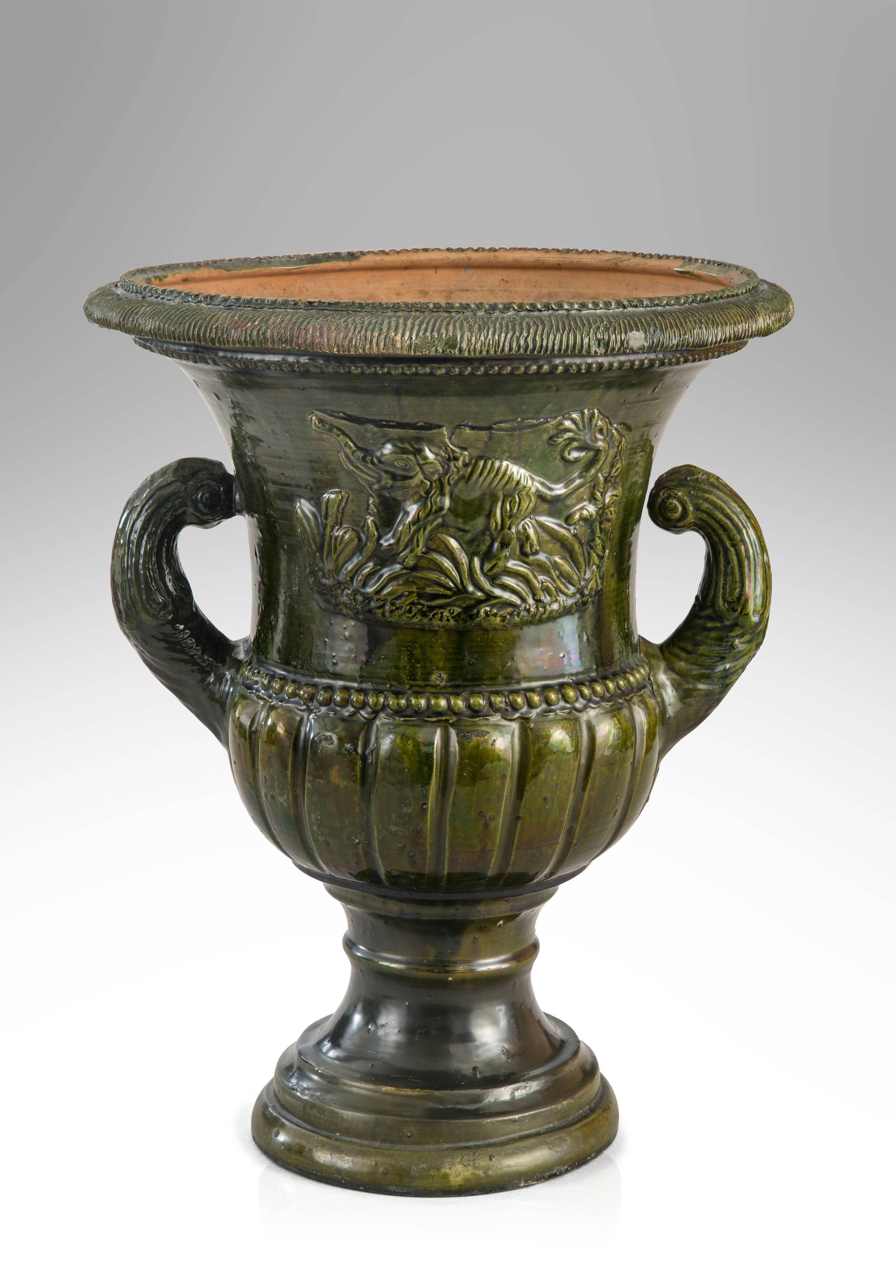 Neoclassical A French Green Glazed Faience Campana Urn with Elephant Relief For Sale