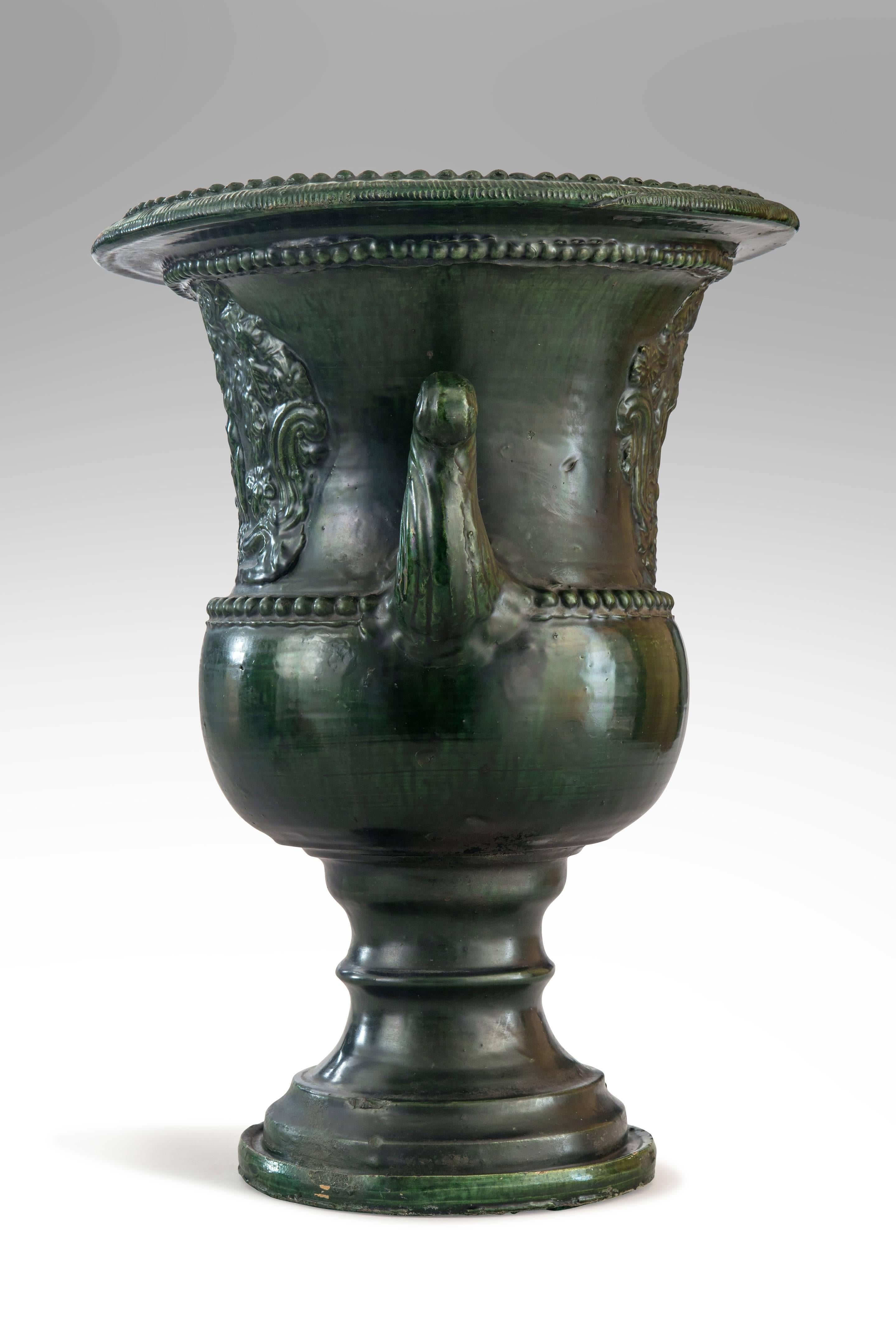Beautiful modeling and richly glazed with a complex antique green. A French Green Glazed Faience Campana Urn with Classical Relief

Very good antique condition, ready to add to your collection. 