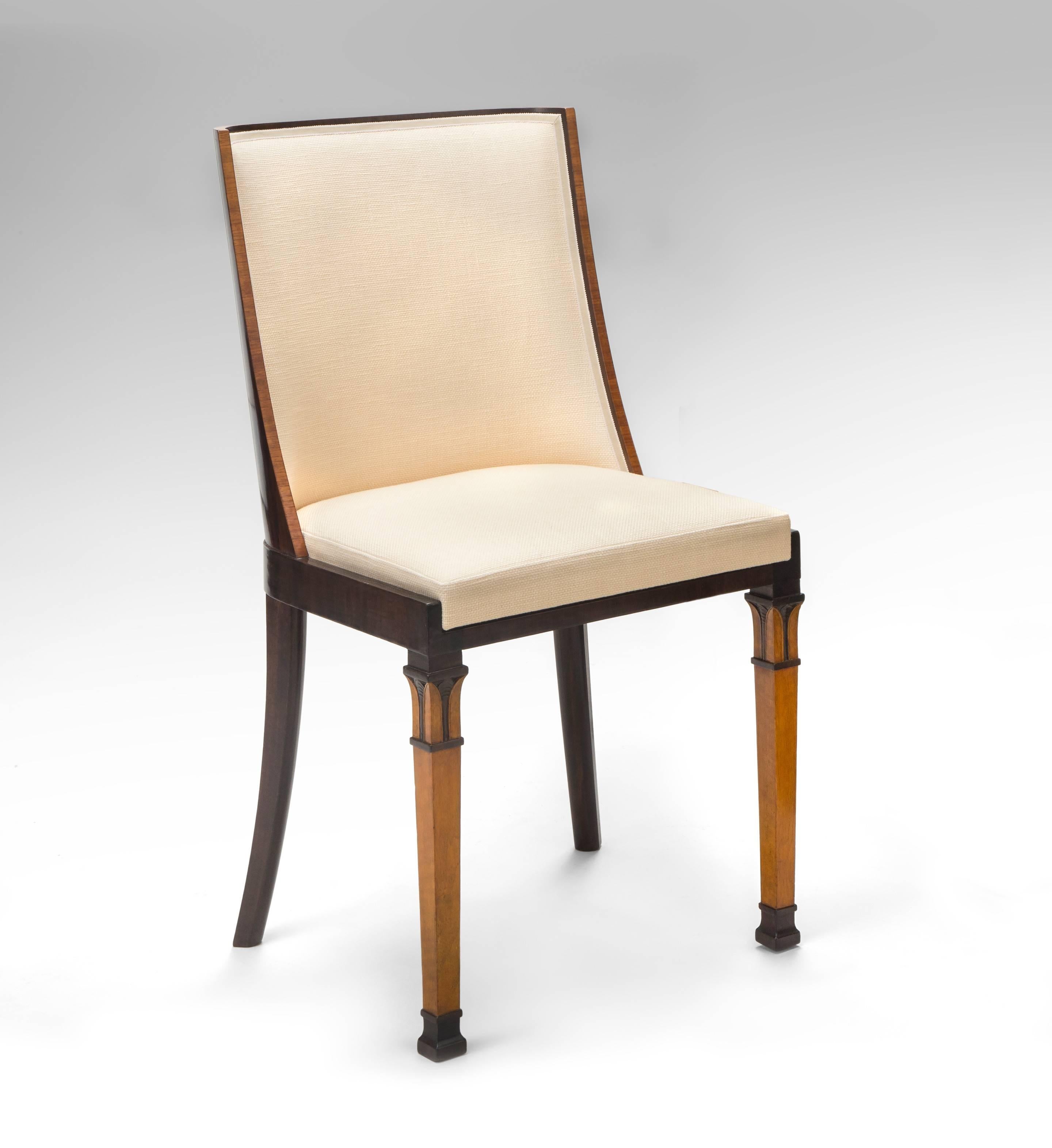 The back inlaid with a marquetry panel of an urn flanked by scrolls, the inner back upholstered, the rectangular seat on square tapering legs front and saber legs back.

Very good condition, expertly restored, newly upholstered, and ready to add to