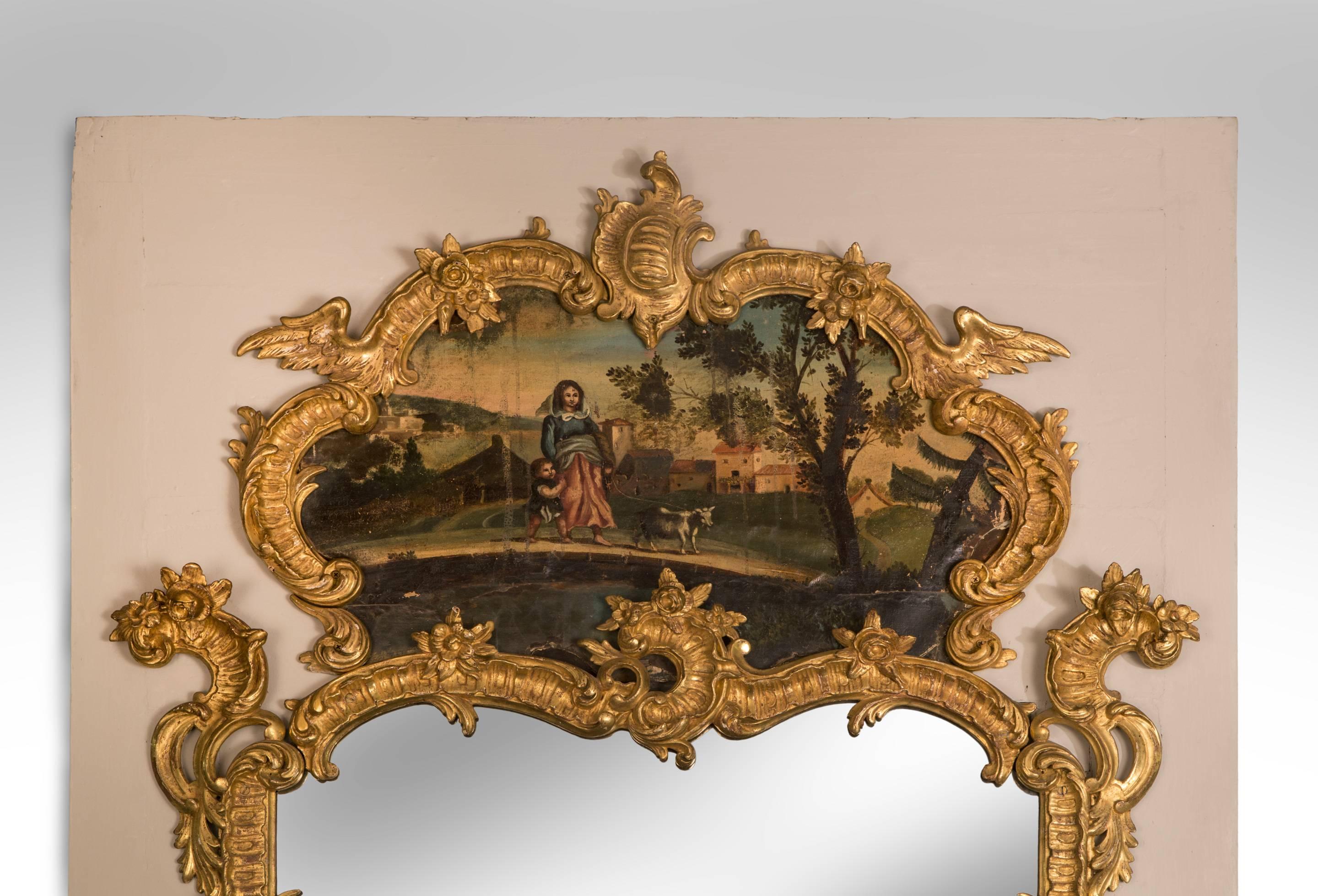European A Large Louis XV Rococo Carved Giltwood Trumeau Mirror