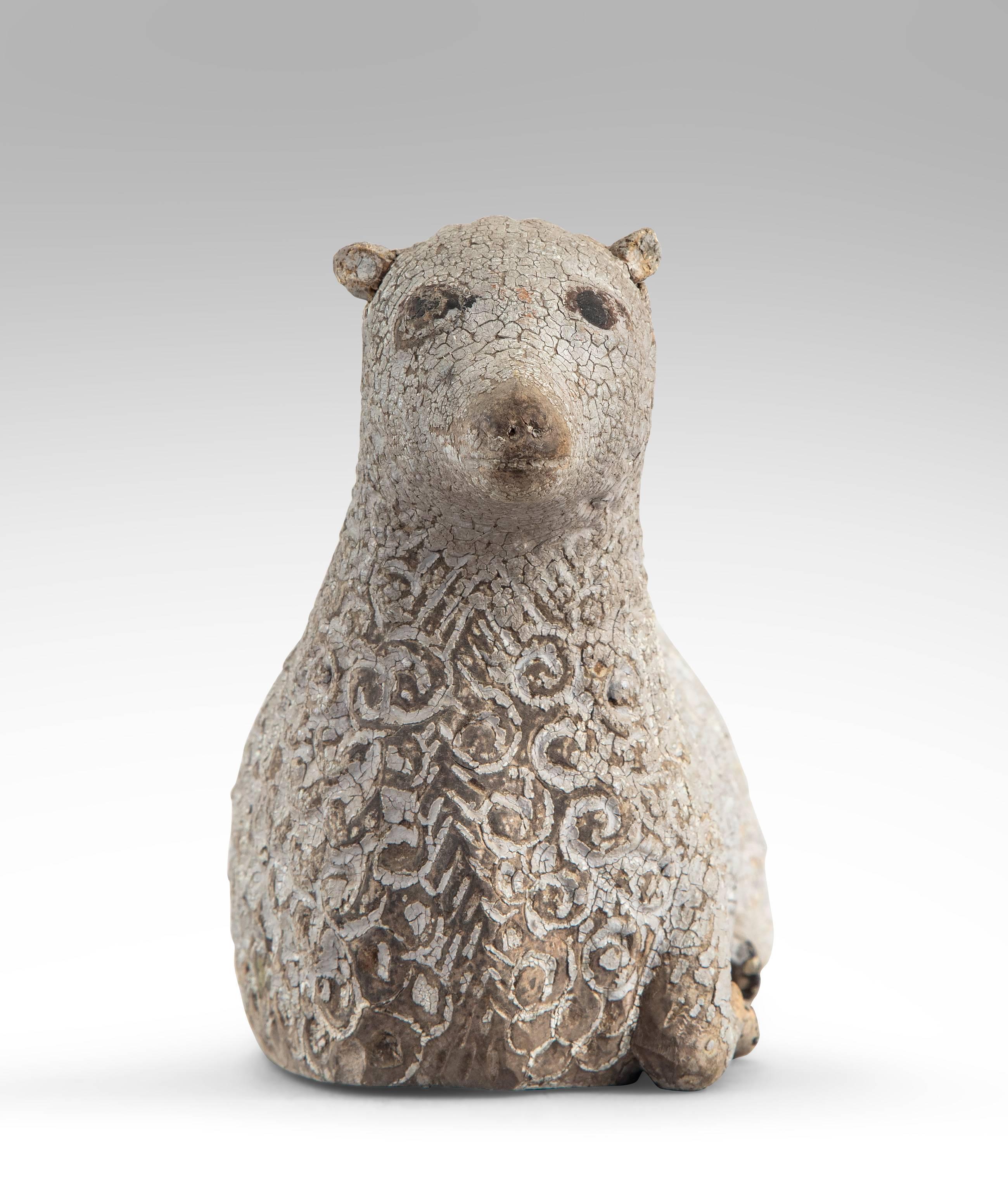 Charming and well carved lamb with a lovely old paint. Seated and facing forward with a gently scrolled fleece.