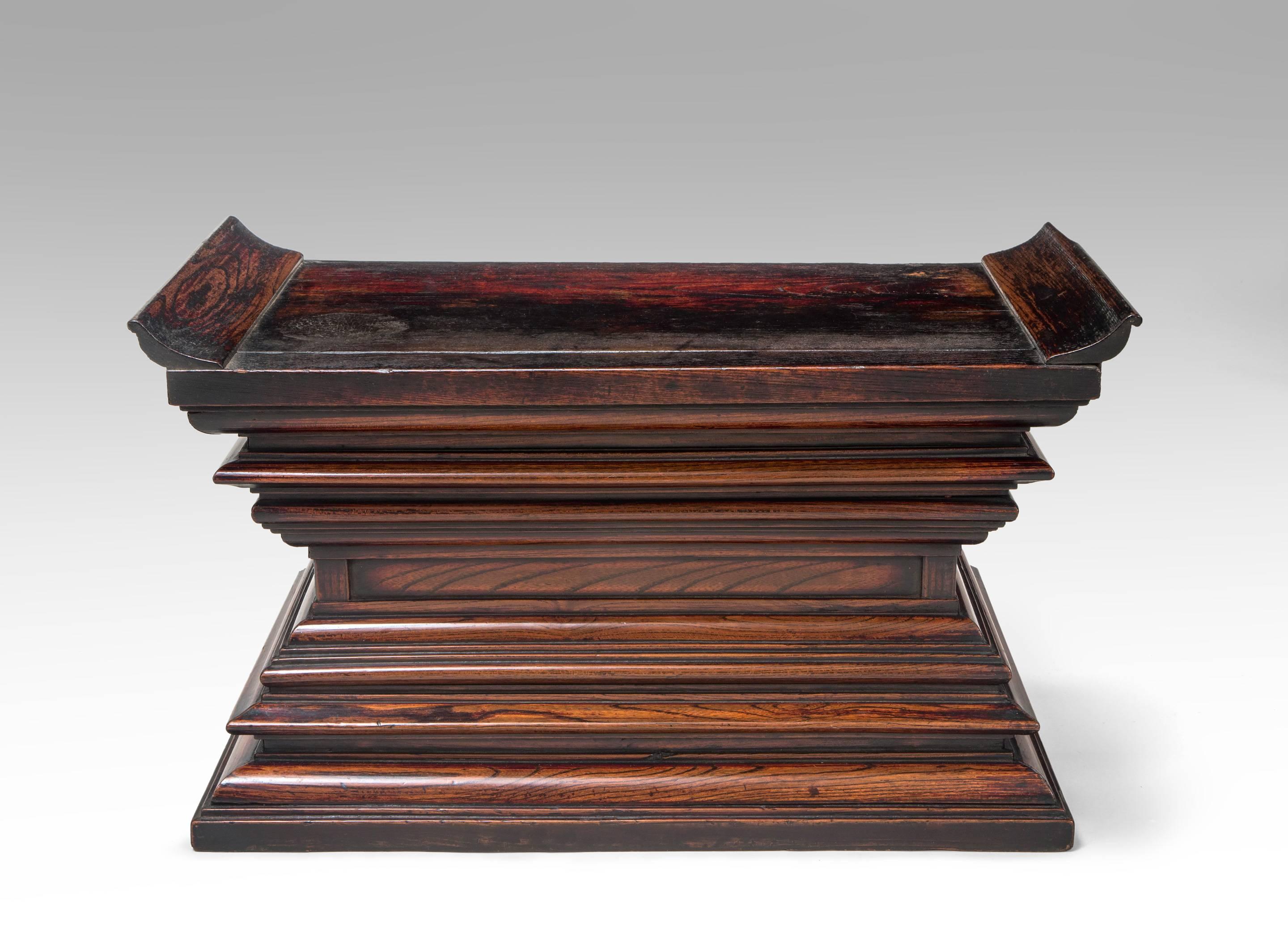 Lovely color and complex yet harmonious design altar / plinth. The rectangular platform with upturned ends, above the stepped waisted plinth, the back open. Shows signs of use and age, in overall very good condition.