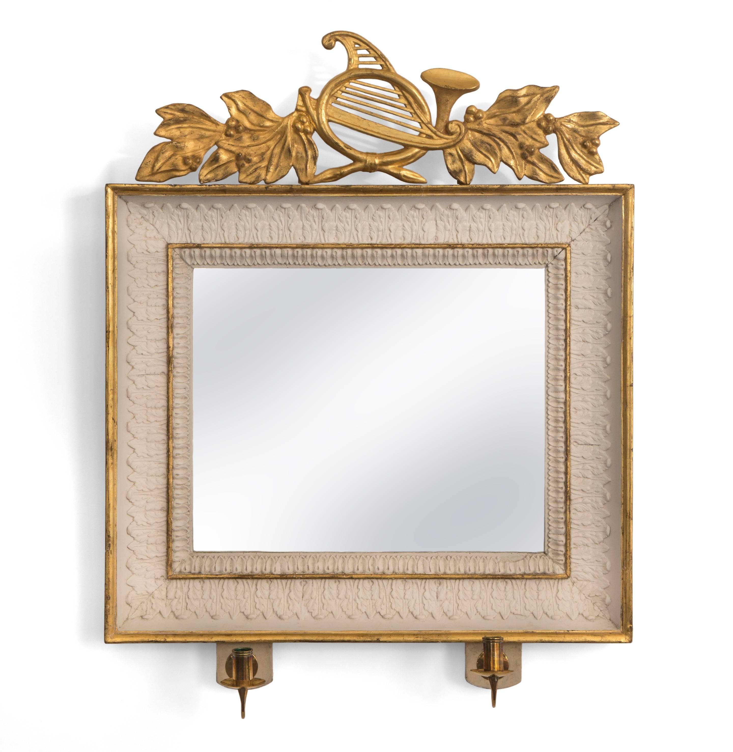 A pair of Swedish empire period painted and parcel-gilt wood rectangular mirrors with candle arm. 
Each rectangular mirror plate, within a leaf-tip molding, surmounted by a horn and harp issuing laurel leaf garlands, terminating in paired acanthus