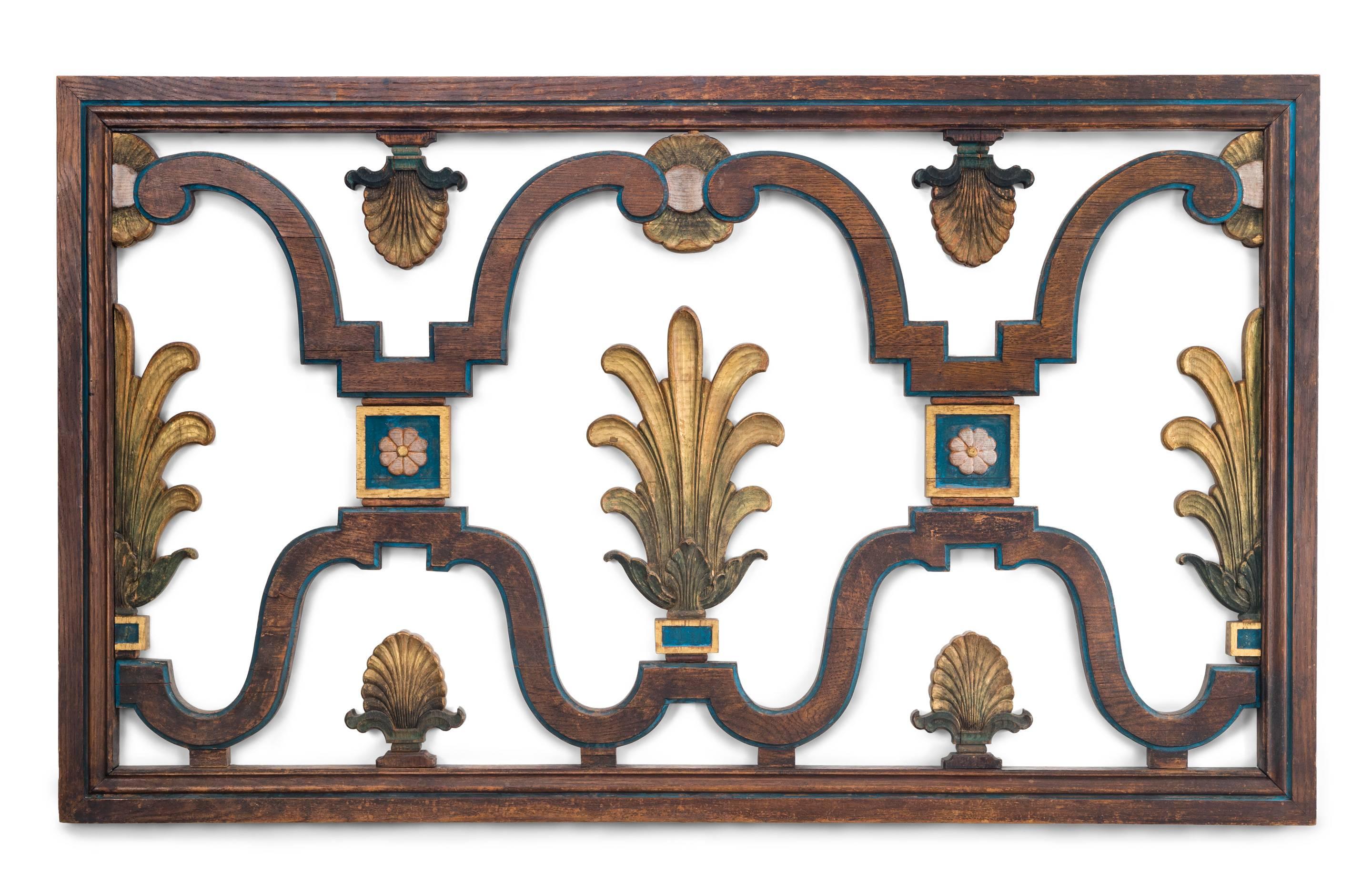 Can be hung on the wall like a picture (removing feet) or as a fire screen. In beautiful condition, the subdued and naturally patinated oak highlighted by mellowed original paint and gilding. The rectangular frame enclosing undulating scrollwork