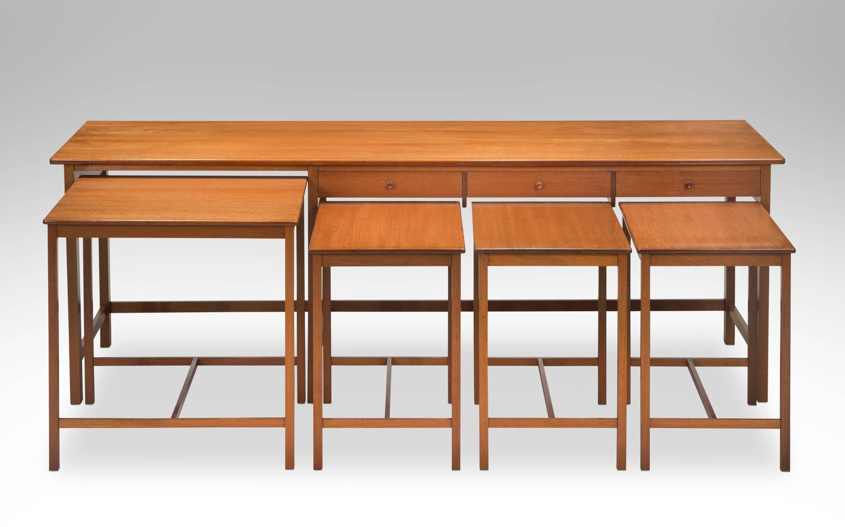 A deftly executed and innovative design for its time. The simple, lightweight construction is a precursor to later 20th century trends. The rectangular top with rounded ends, above a three drawer frieze, each drawer centering a small handmade wooden