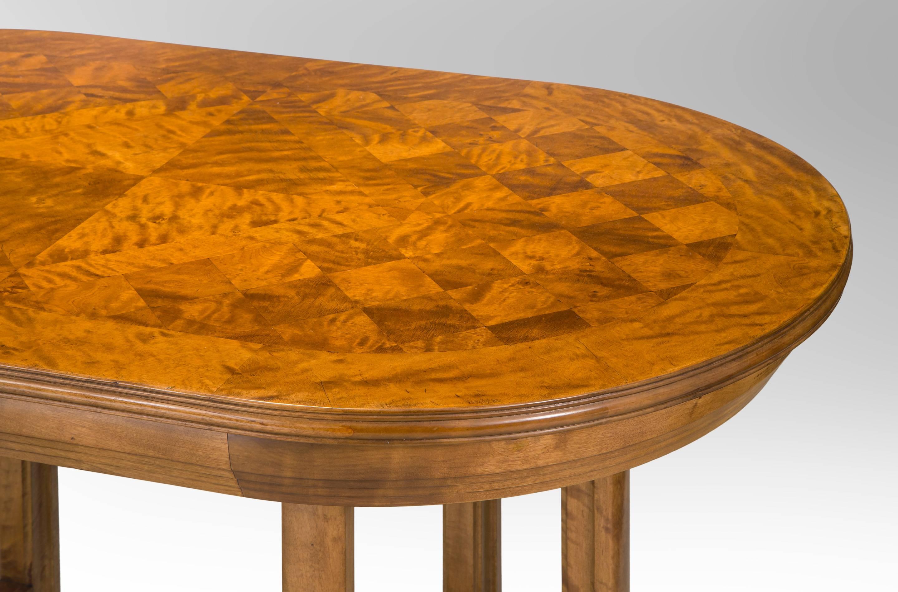 An exceptional table with an especially beautiful parquetry top from a period where a very limited number of pieces were created; its remarkable design maybe unique. The oval top composed of diagonal squares with a large diamond-shaped center, the
