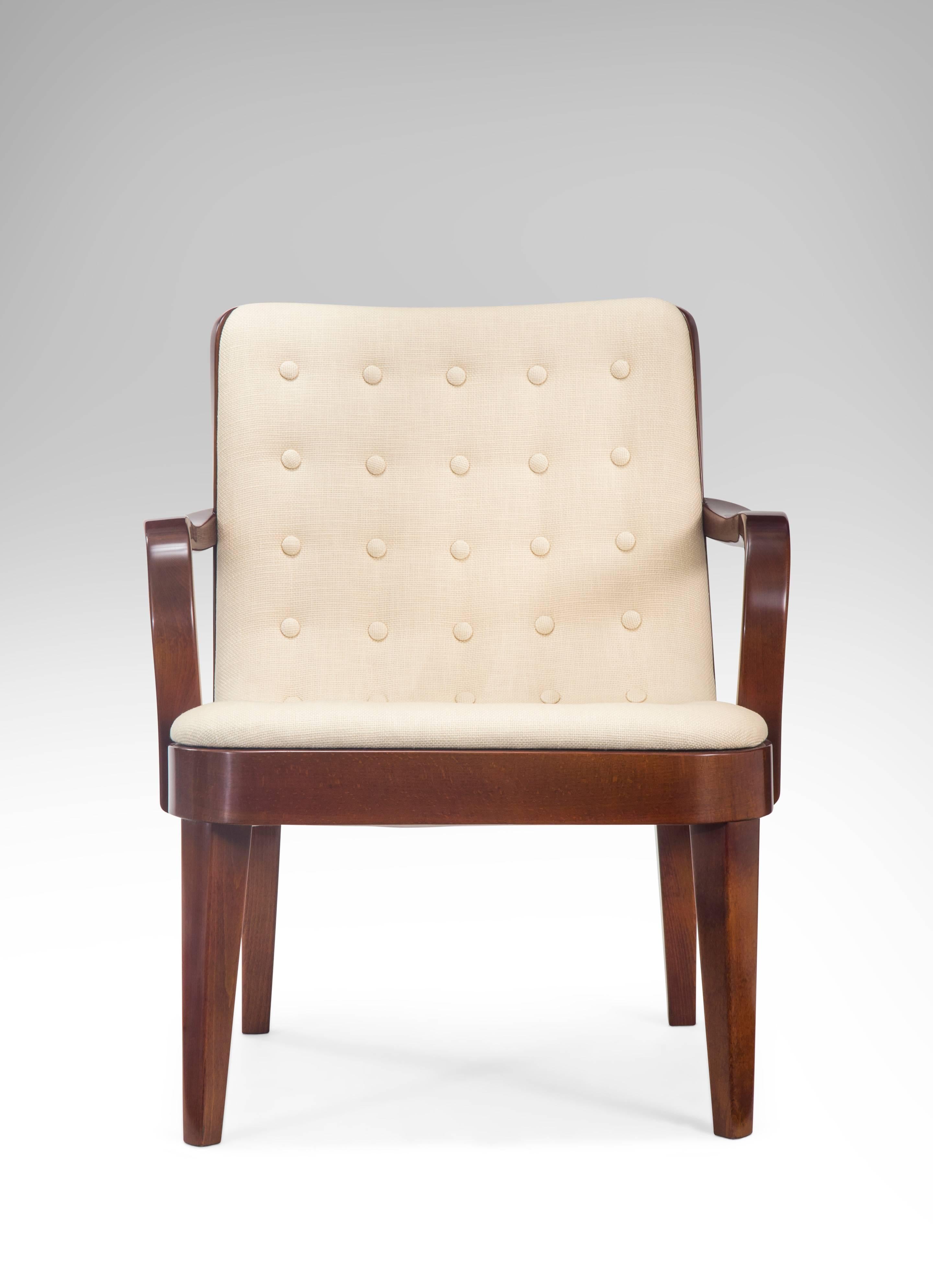 A sophisticated and comfortable design by Axel Larsson. Each concave toprail, above a profusely tufted upholstered back and seat cushion, issuing two curved arms, on tapered legs.

In very nice condition, beautiful finish, new authentic