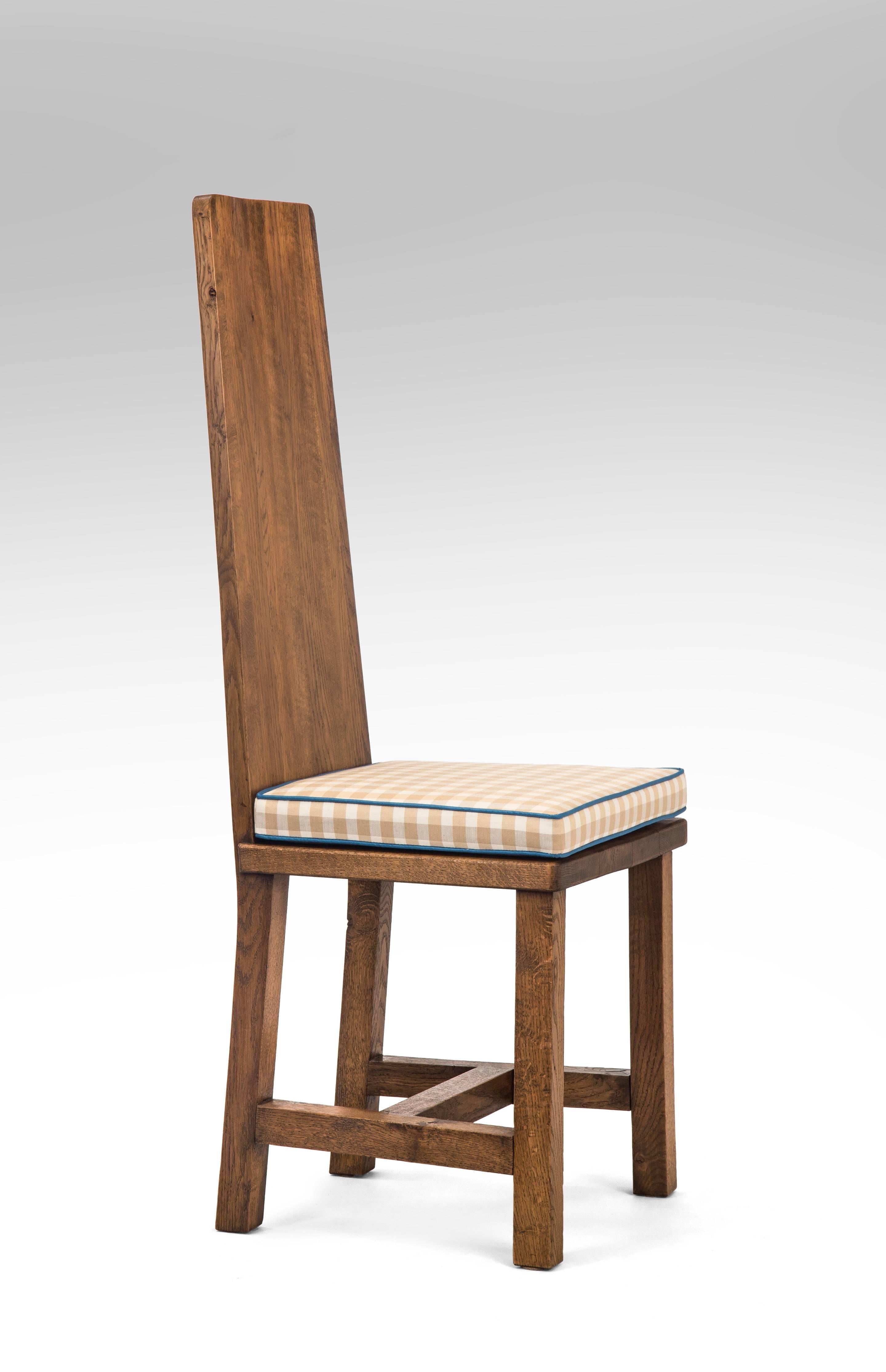 Set of 6 Swedish Oak Jugendstil Chairs.  
A set of honest chairs, strong and forthright in design. Each of solid oak with a high-back, above a trapezoidal seat, raised on square legs connected to a square stretchers. 
Circa 1910