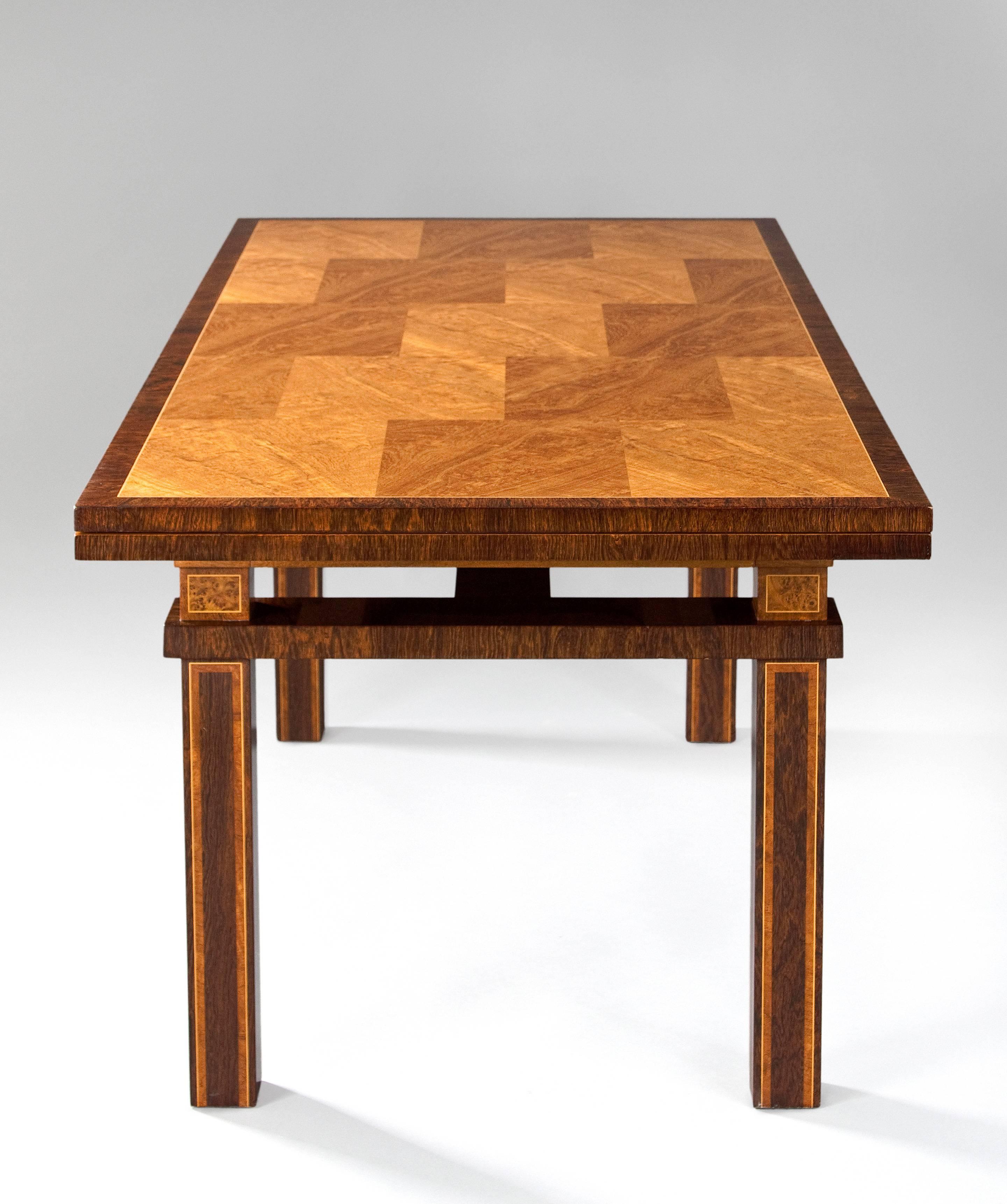 Carl Malmsten Swedish Grace Period Rosewood and Thuya Extendable Dining Table
The rectangular top composed of rectangular panels, with two 25.5
