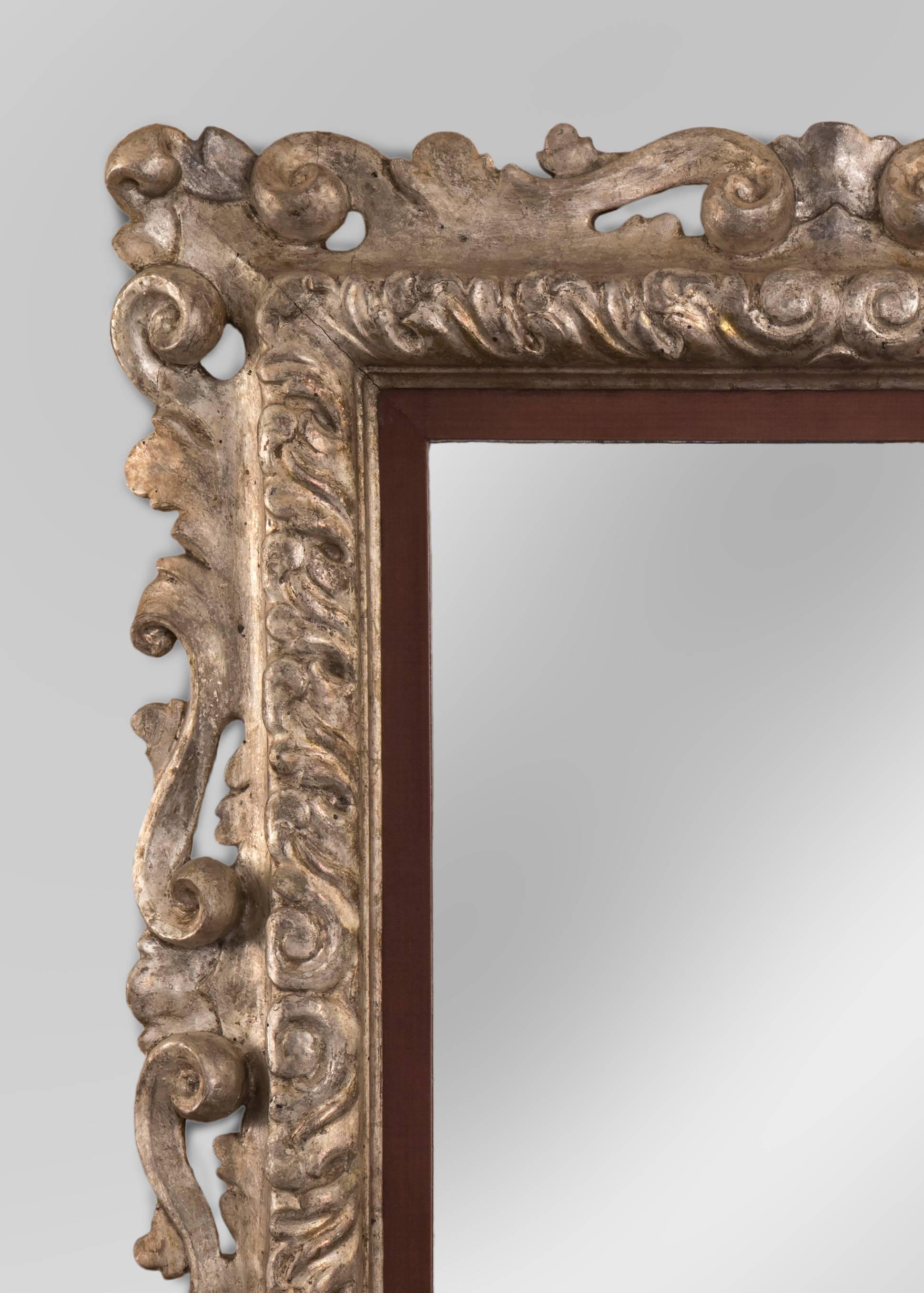 An Italian Baroque silvered mirror
The rectangular mirror plate within pierced foliate and scroll frame.
Possibly Florentine, late 17th century or later.