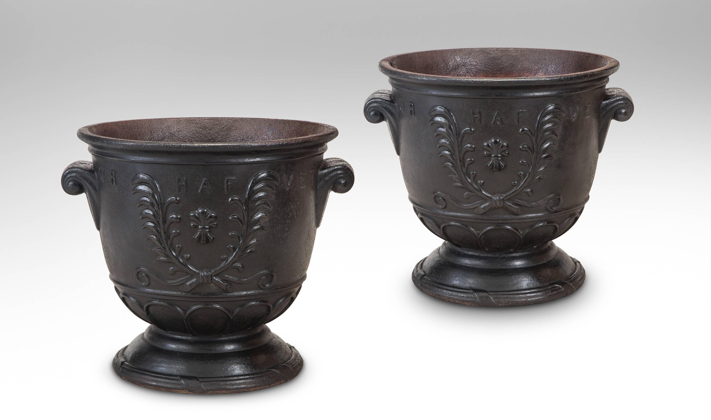 Ivar Johnsson for Näfveqvarn Bruk, Pair Swedish Case Iron Venus Rising Urns
The tapering circular urn on a molded socle, mounted at the sides with scroll handles, the front with a relief of a kneeling Venus holding a robe and inscribed Venus Stiger,