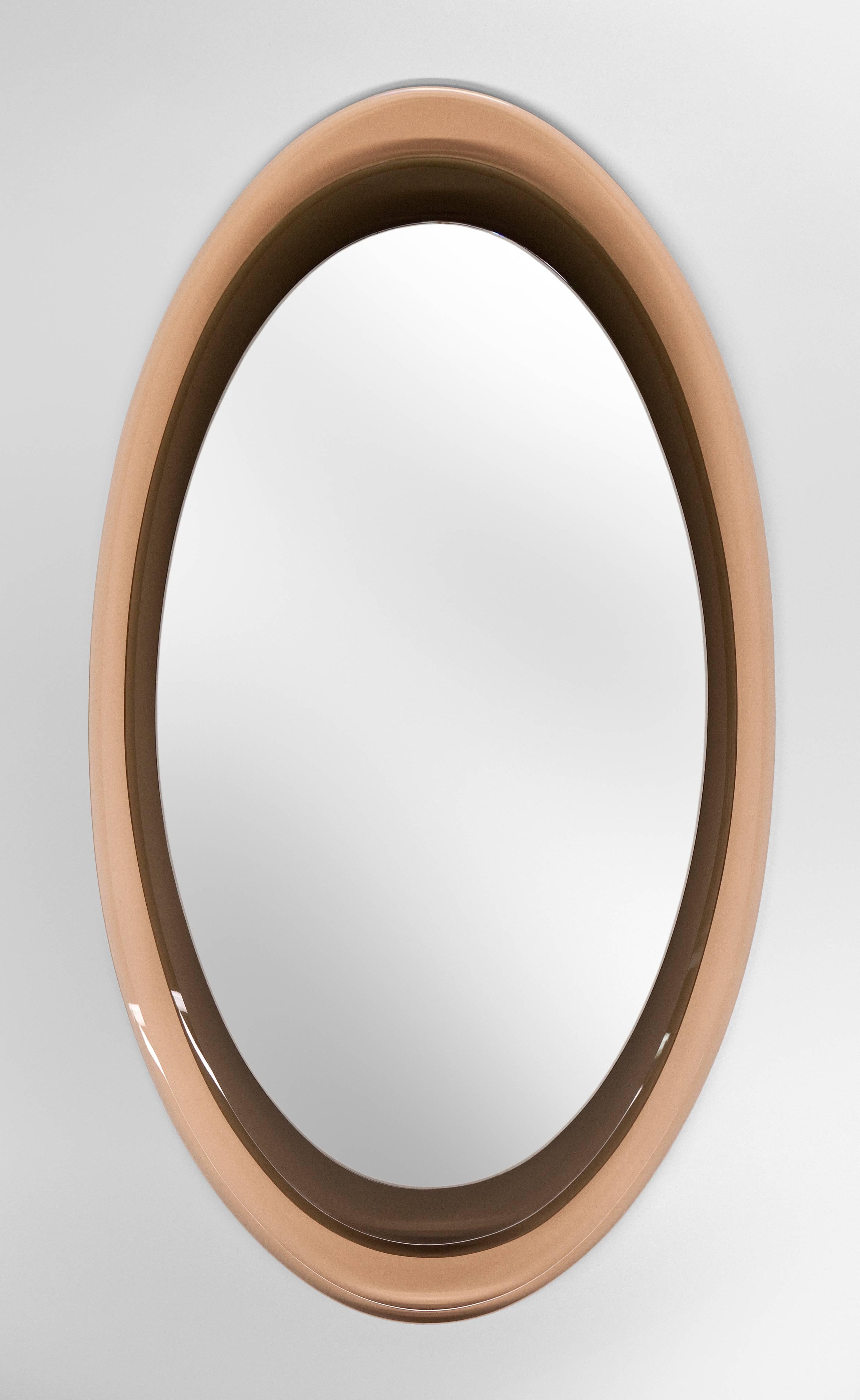 Max Ingrand for Fontana Arte, Two Color Glass Framed Mirror, Model 2046
A beautiful design, gorgeous glass and great condition. The elliptical mirror plate, floating above two tiers of beveled Fontana Arte rosambrato (rose amber) and grey colored