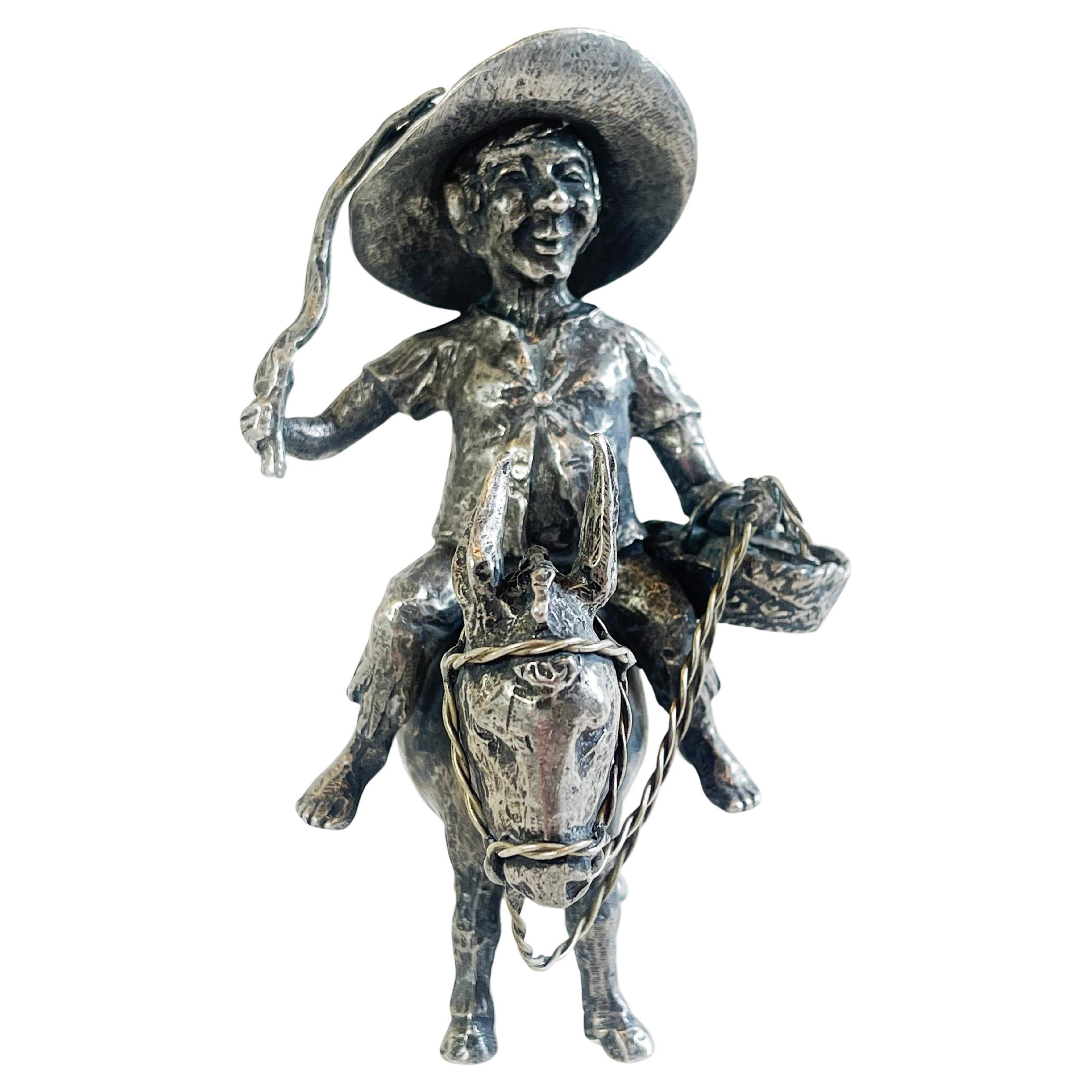 Sancho Panza montado en su burro, estatuilla de estaño esculpida por Michel Laude, Francia