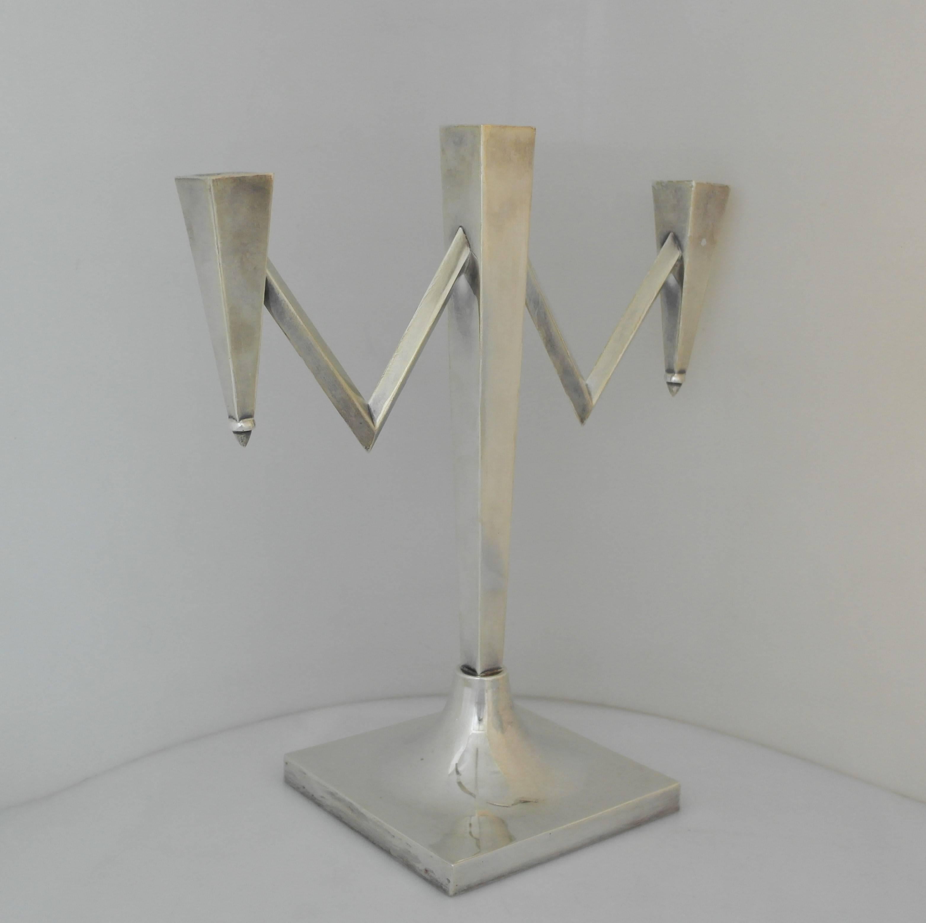 Offering a large and superb sterling silver 3-light candelabra made in Mexico (maker unknown). Incredible example in the modernist taste; of square form with 'v' shaped arms; all on raised square base. Dimensions: 14 inches height x 13 inches