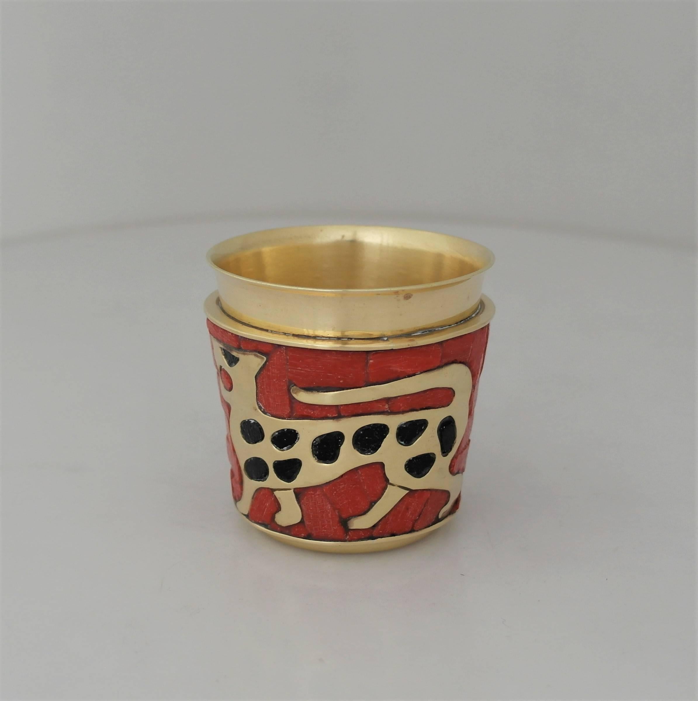 Being offered is a circa 1960s bar cup made by Salvador Teran of Taxco, Mexico. Cup is made of hand wrought brass with glass mosaic inlay. Has a leopard motif. Dimensions: 3