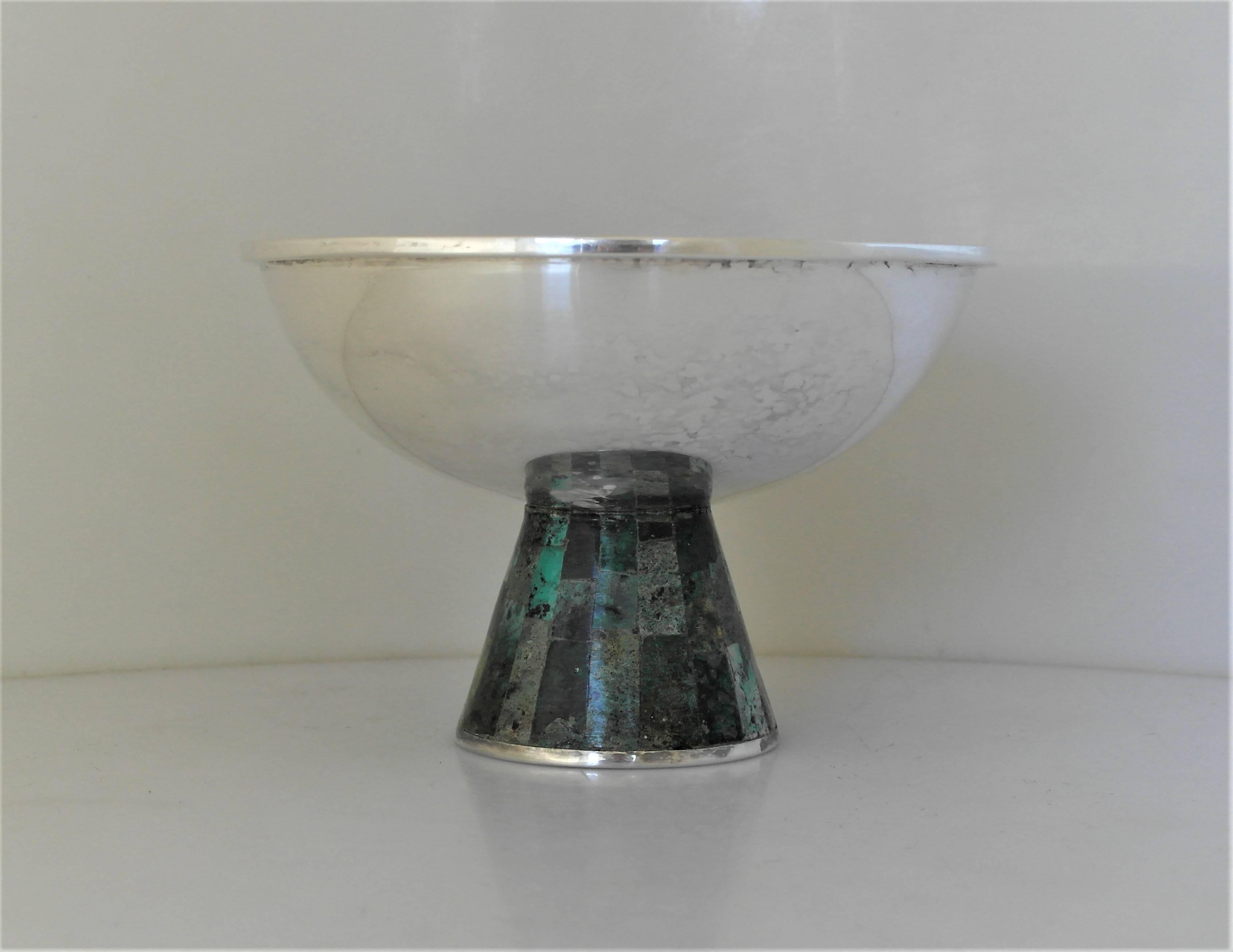 Being offered is a superb circa 1955 silver plate and azur malachite pedestal bowl made by Los Castillo of Taxco, Mexico.  Handmade raised bowl features a pedestal base with azur malachite stone inlay. Dimensions: 4 1/2" height x 5"