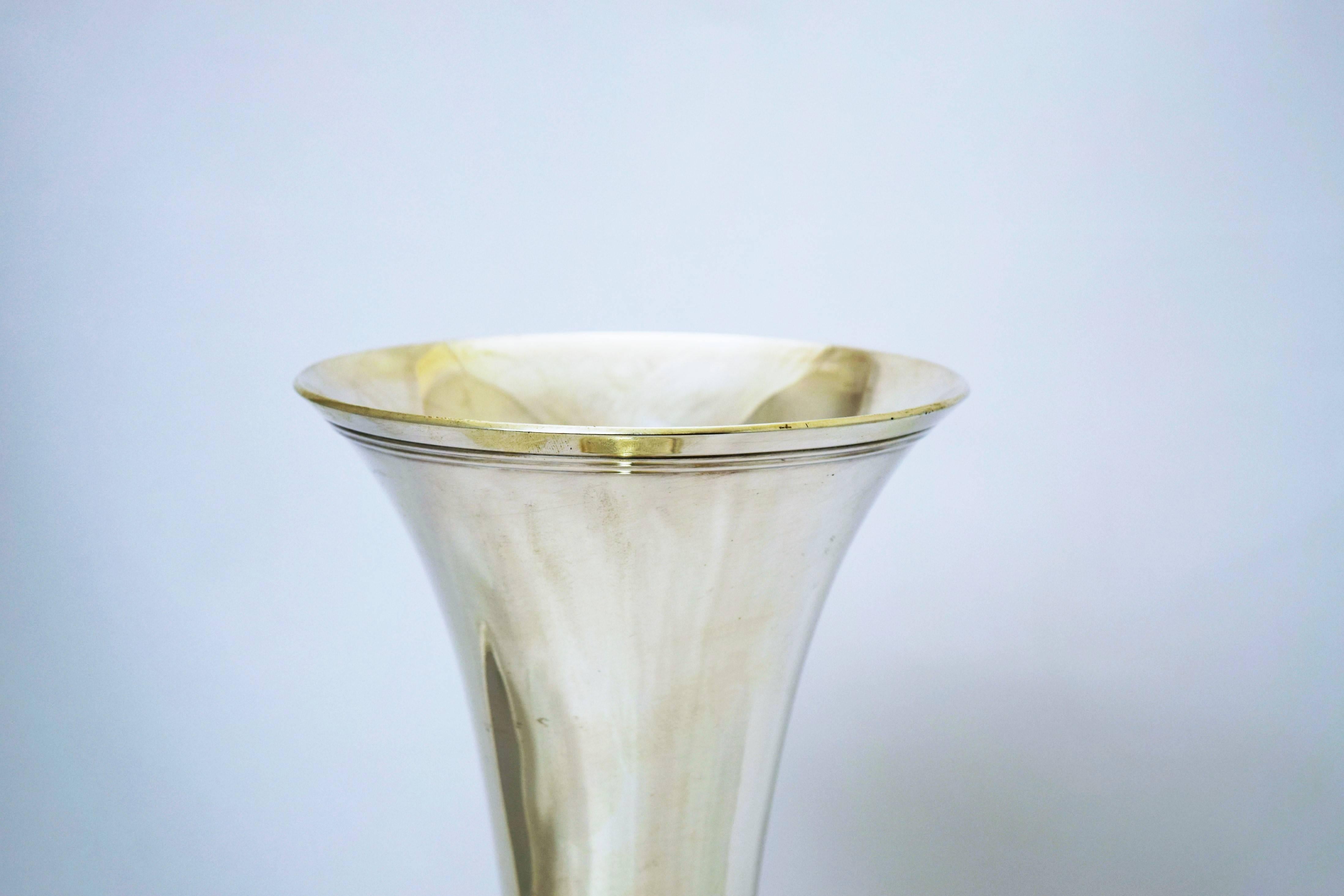 Being offered is a sterling silver vase made by Tiffany & Co. of New York. Trumpet form with a simple modernist design, circa 1915. Dimensions: 14 inches tall. Weight 20 troy ounces. Marked as illustrated. In excellent condition.