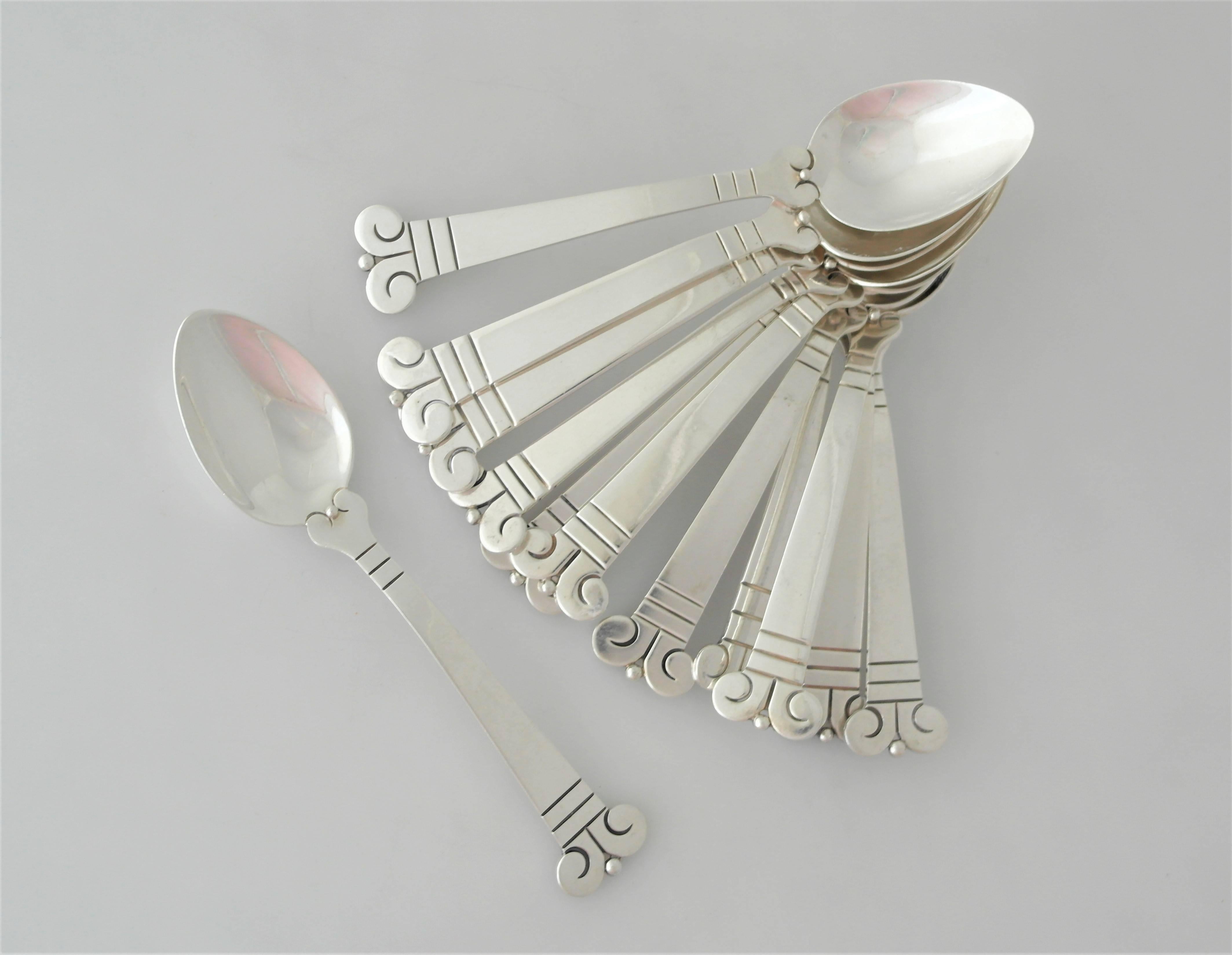 Being offered are a set of 12 spoons made by Hector Aguilar of Taxco, Mexico.