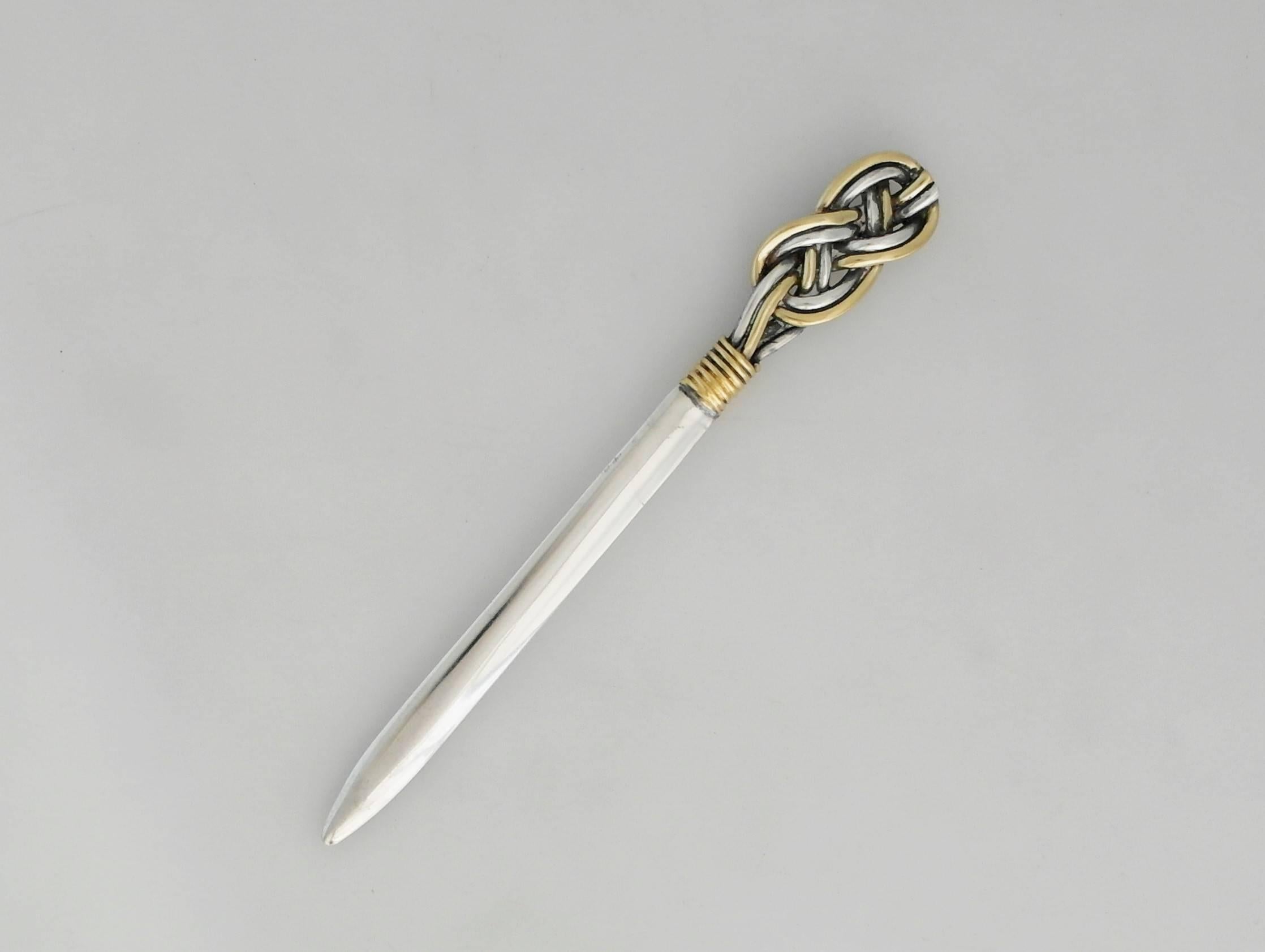 Being offered is a sterling silver letter opener by Tane of Mexico City. Stunning desk object comprising an interwoven rope handle with gilded detail, extending to a smooth blade. Dimensions: 7 inches long x 3/4 inches wide at the handle. Marked as