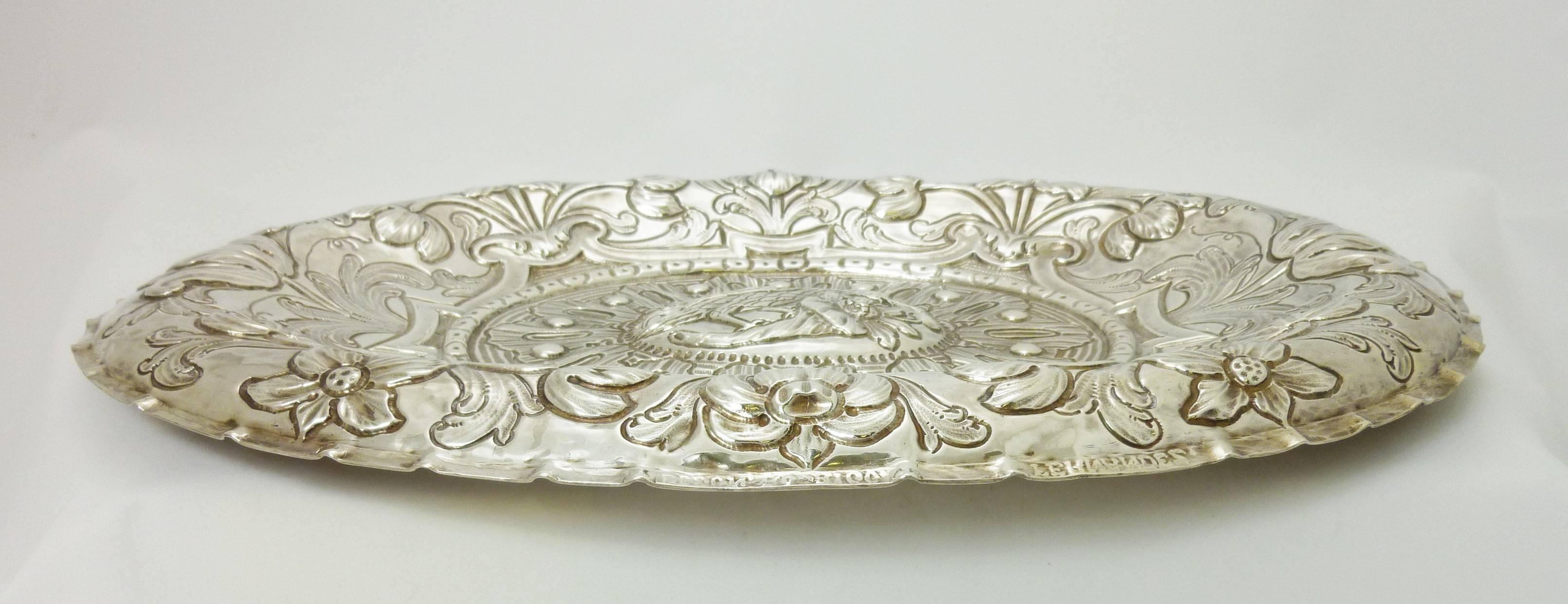 Being offered is a Spanish, or Spanish Colonial silver dish. Impressive object made during the first half of the 18th century, with all-over hand embossed motifs. Dimensions: 19 inches x 14 inches. Marked as illustrated. In excellent condition.