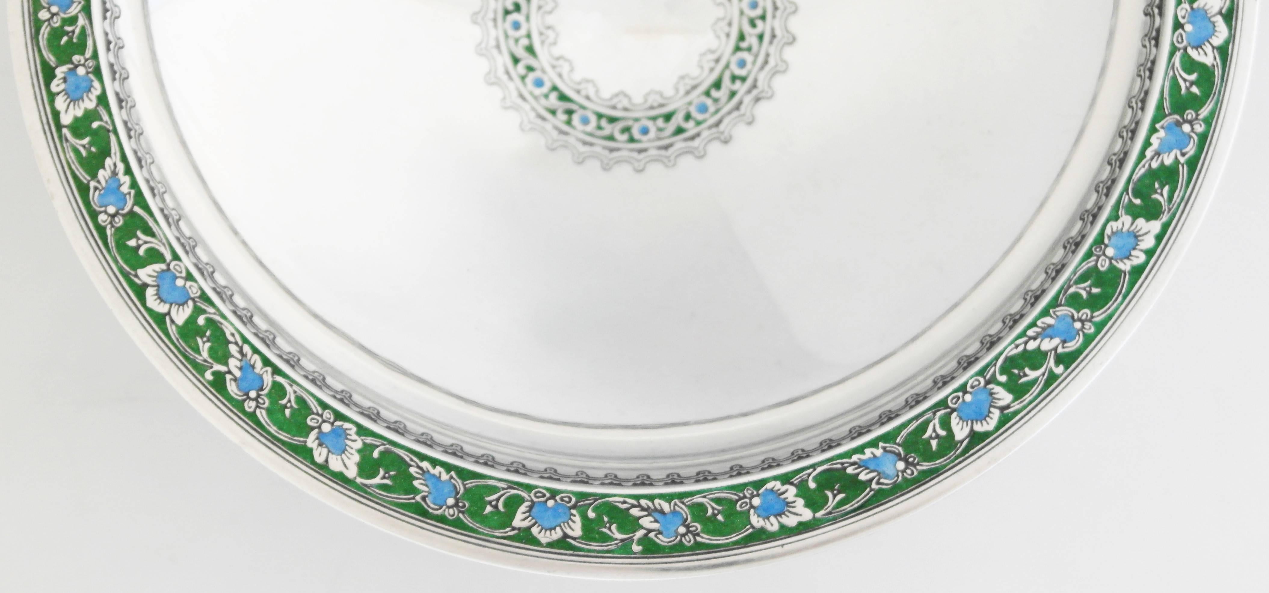Being offered is a circa 1920 sterling silver bowl by Tiffany & Co. of New York. Art Deco piece, of pedestal form with intricate enameling at the edge & center. Dimensions: 8 inches diameter x 2 1/4 inches height. Weight 13 oz. Marked as