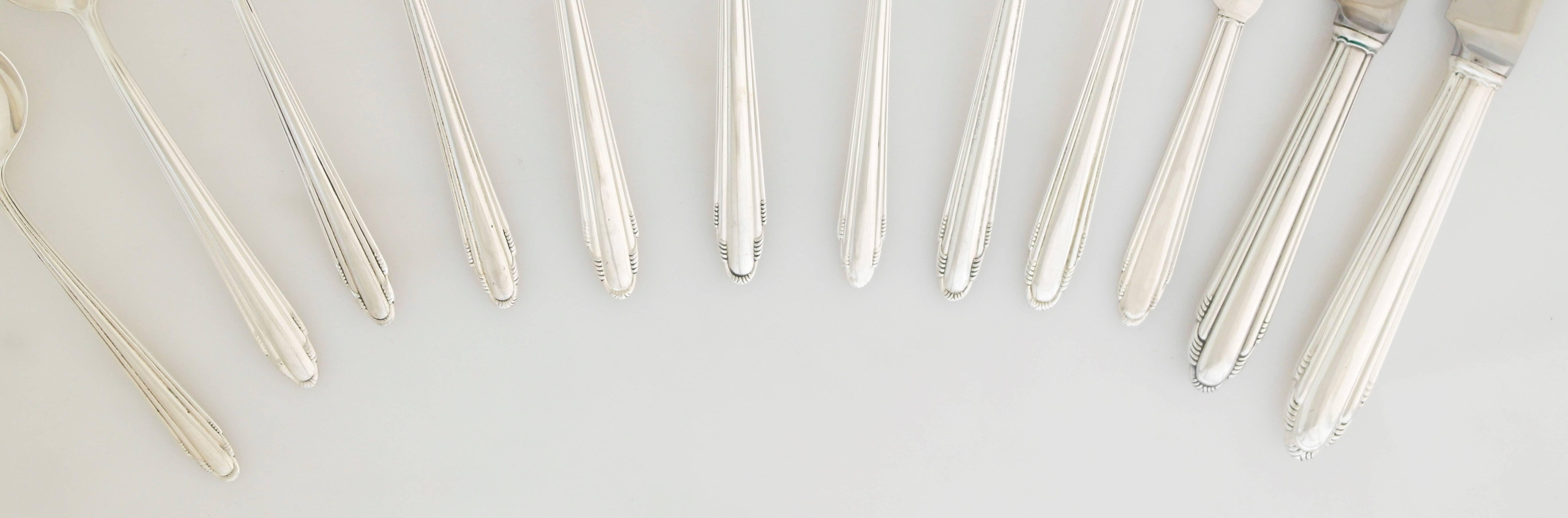 Being offered is a large and exceedingly rare sterling silver flatware set by Dominick & Haff of New York. In the Contempora pattern designed in 1930 by famed architect Eliel Saarinen.

In 1927, Finnish-born Eliel Saarinen was one of nine