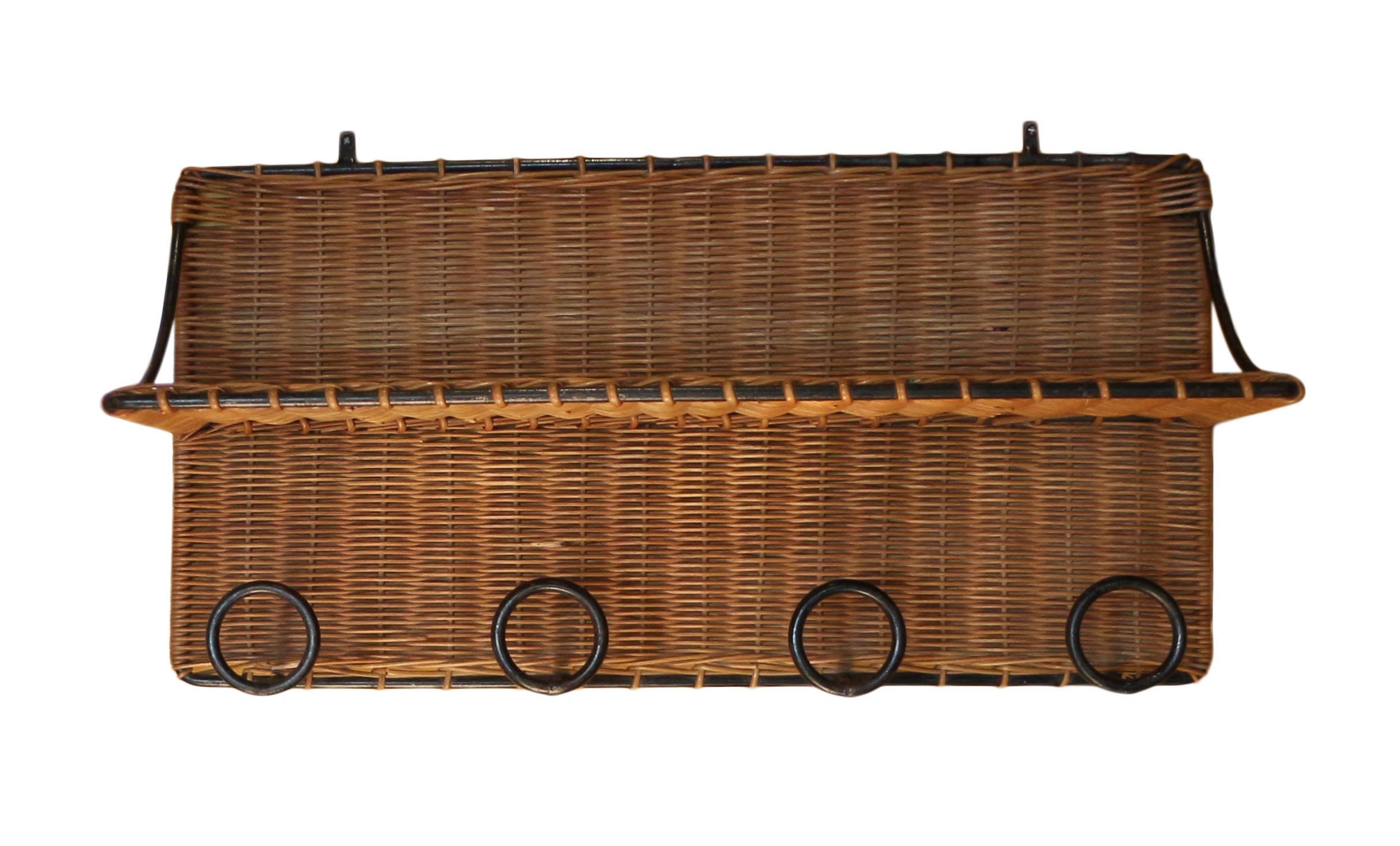 French midcentury rattan and iron coat rack in the manner of Mathieu Matégot.