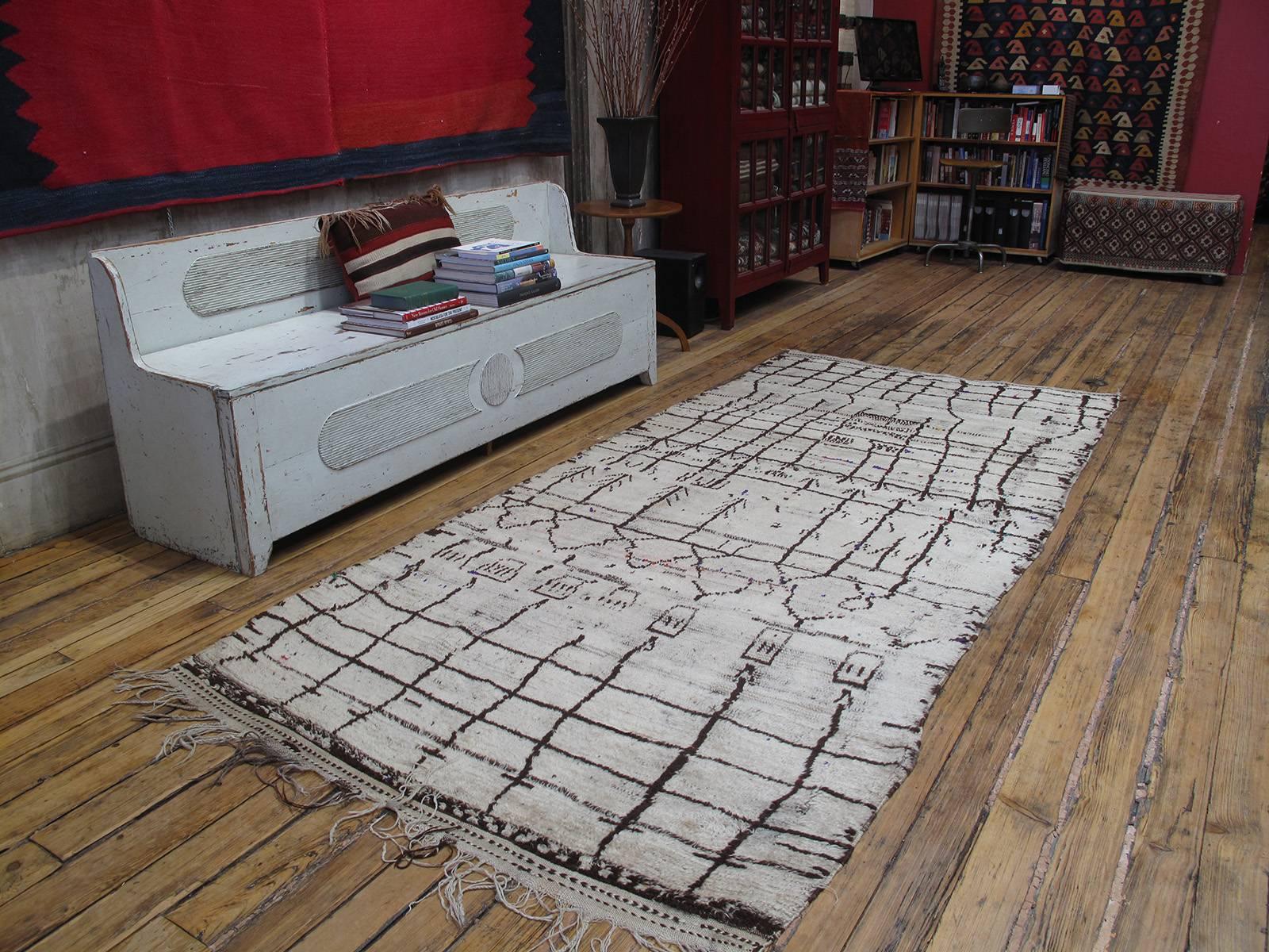 An old Moroccan Berber rug from the Azilal province in the central high Atlas Mountains. This part of Morocco remains a prolific center of weaving to this day, with many local weavers still creating rugs for family use. The history of weaving in the