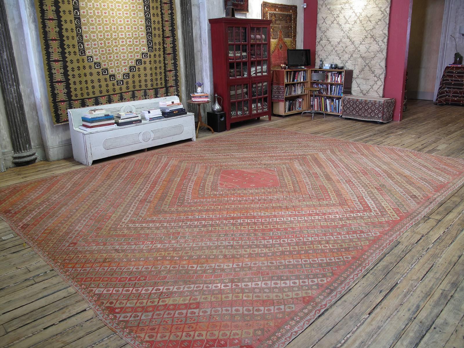 A lovely antique kilim from Eastern Turkey, with soft color palette and of unusually large size. Such large kilims were ordered for wealthy local patrons from villages where skilled tribal weavers could be contracted for such work. This concentric