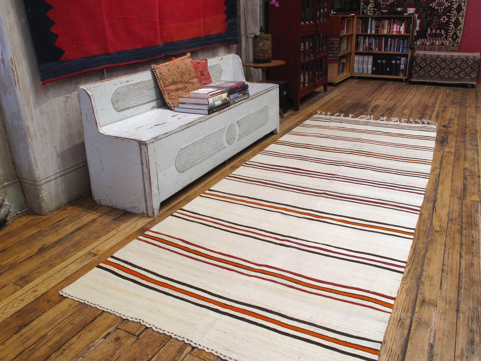 Striped Kilim, wide runner rug. An old tribal flat-weave runner rug from Central Turkey, woven in the characteristic wide runner format, intended as a simple utilitarian floor cover. In its authentic simplicity, this rug has great modern/Minimalist