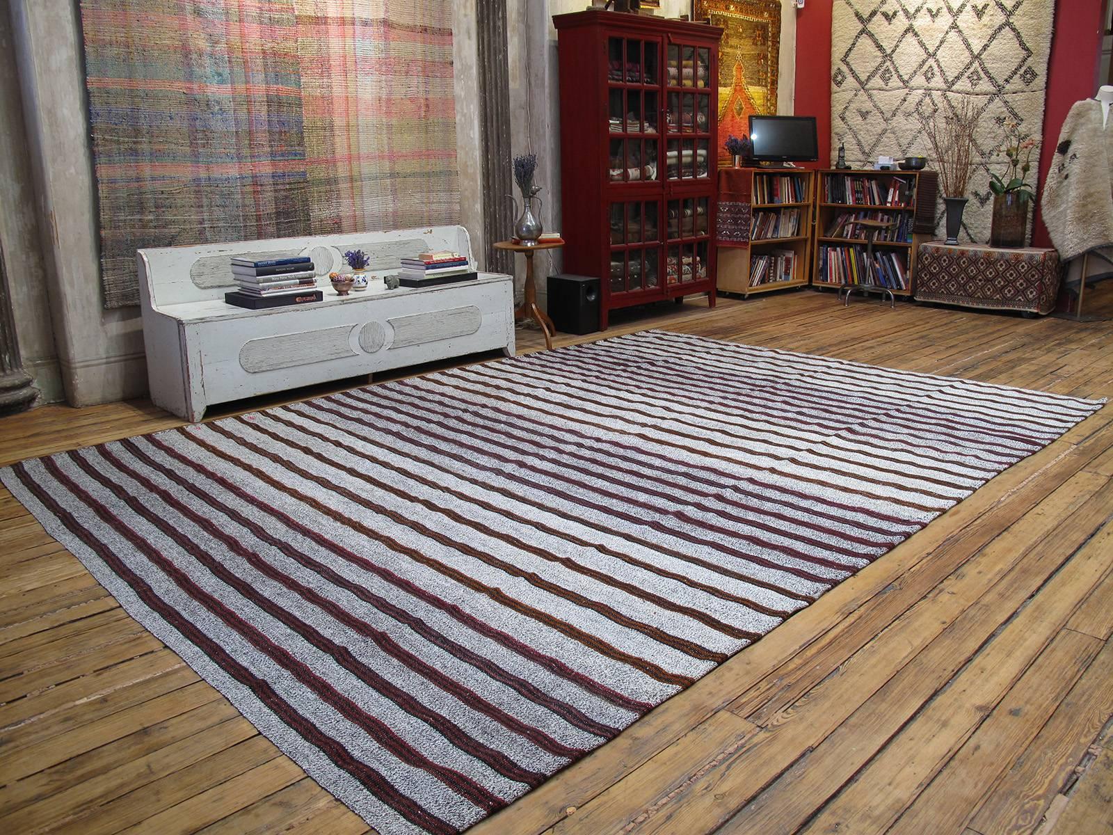 A large old tribal flat-weave from Southeastern Turkey, woven with an ingenious mixture of cotton and goat hair, featuring a pattern of stripes in red and black/brown goat hair. Great modern/Minimalist appeal. The generous proportions are unusual