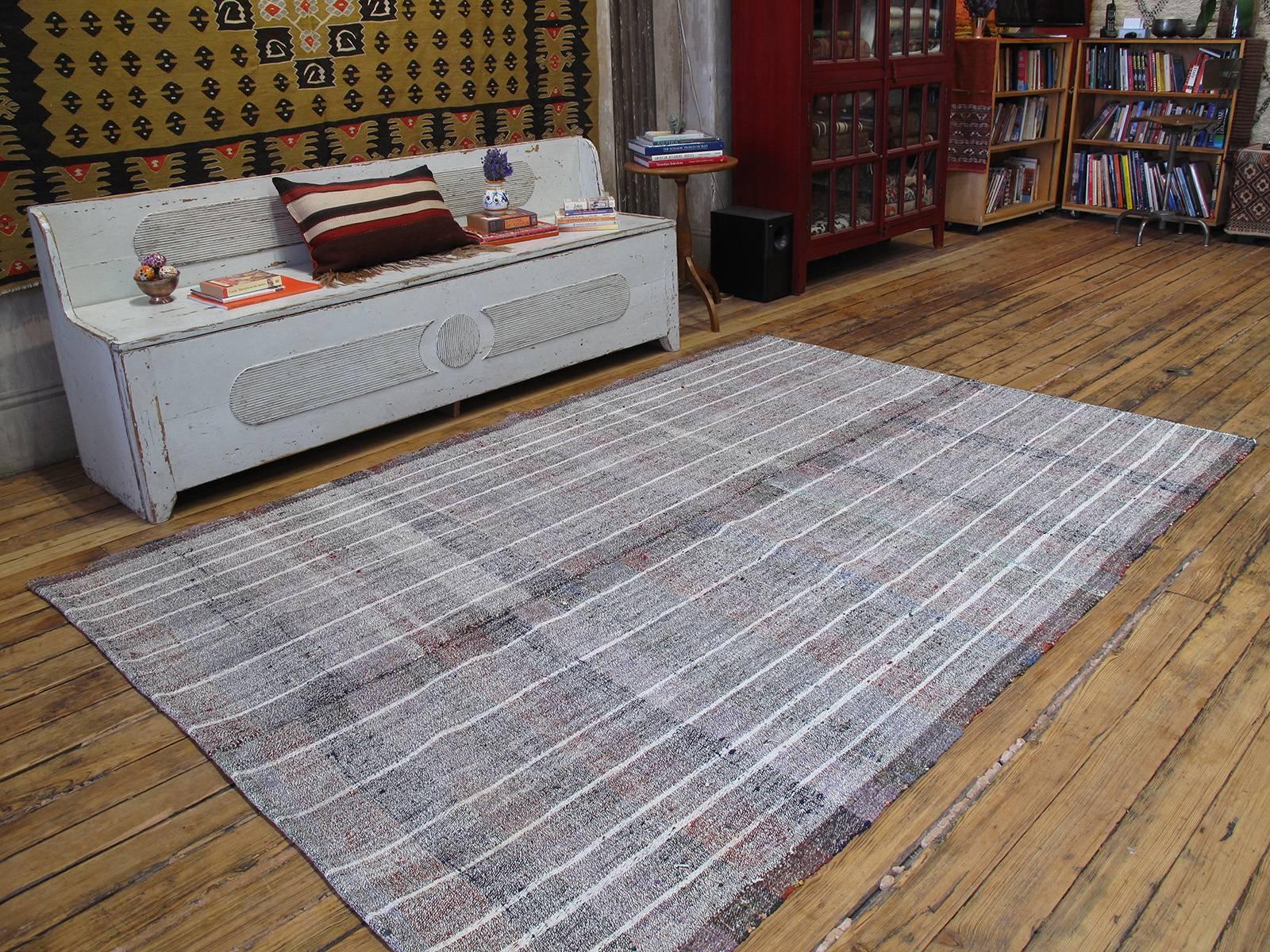 A simple tribal flat-weave from Southeastern Turkey, woven with an ingenious mixture of cotton and goat hair, to serve as a utilitarian floor cover in the weaver's household. Note the use of colorful cotton rag wefts throughout. With its authentic