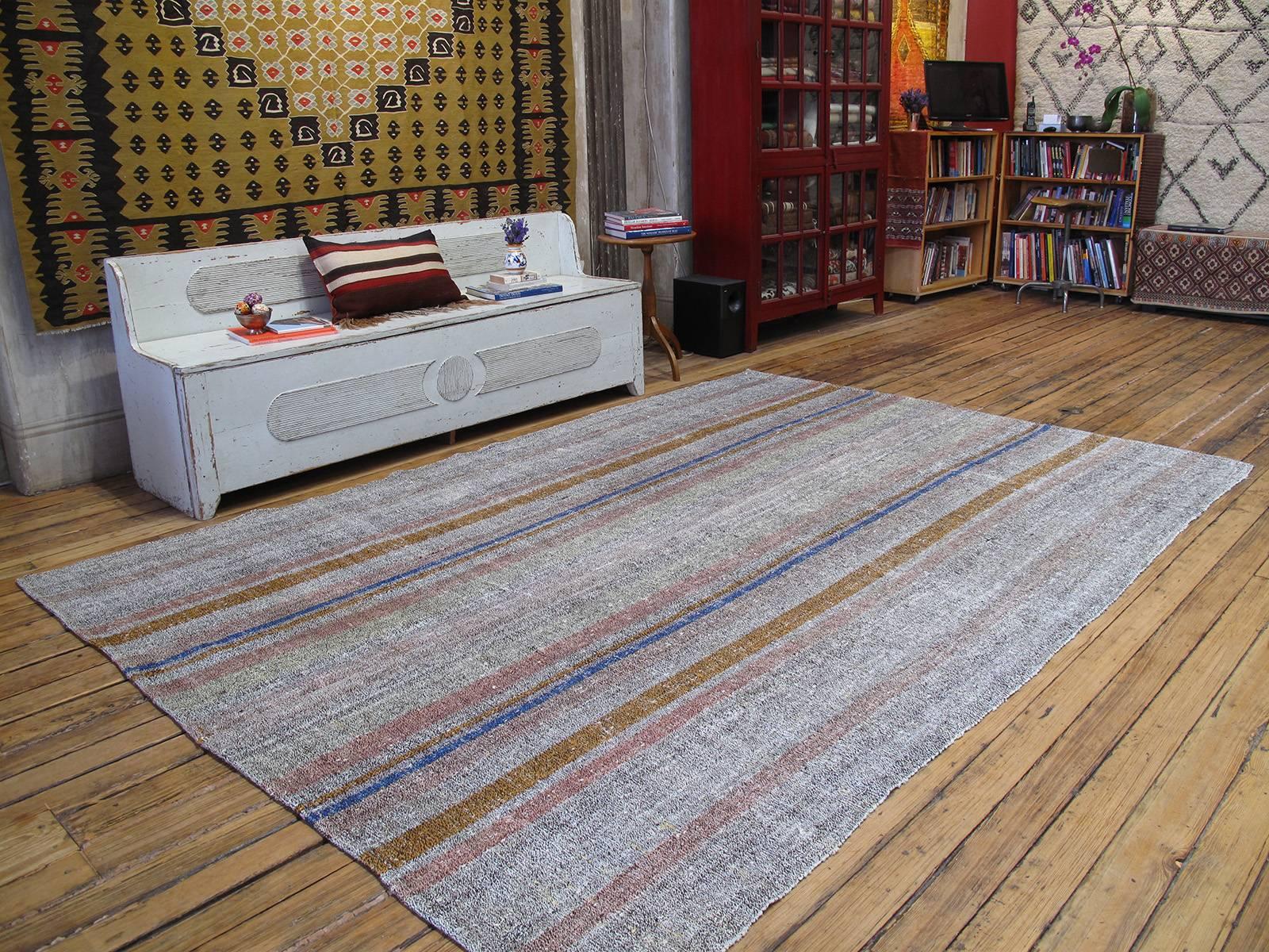 An old flat-weave from Central Turkey, woven with an ingenious mixture of colorful cotton rag and goat hair and used as a sturdy, everyday floor cover in the weaver's household. Great modern appeal with its harmonious color palette and simple