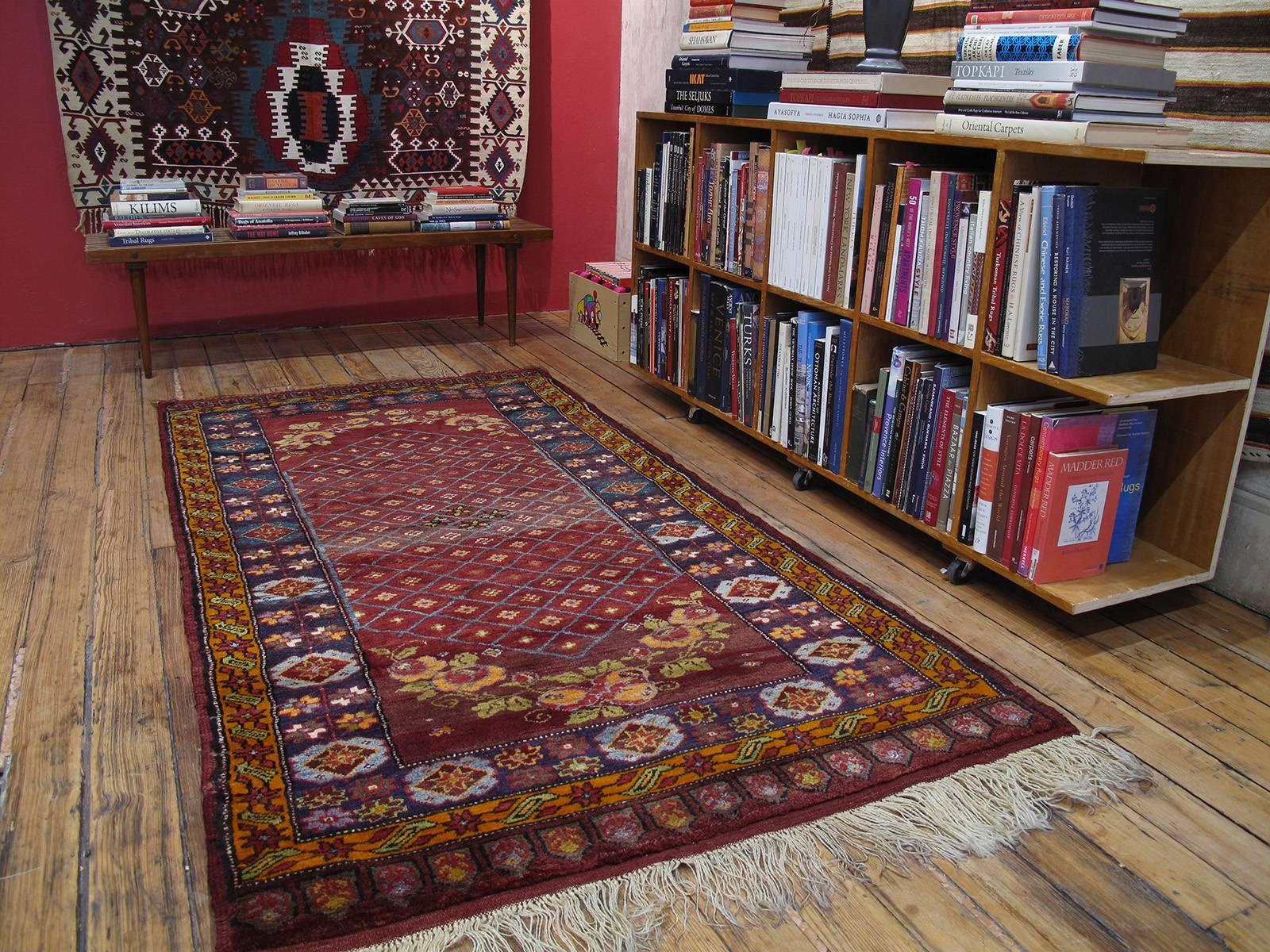 Konya Village rug. A charming old village rug from the highly prolific Konya province in Central Turkey, with many familiar motifs, but with a unique composition featuring beautifully drawn bouquets of flowers at the two ends of the field of the