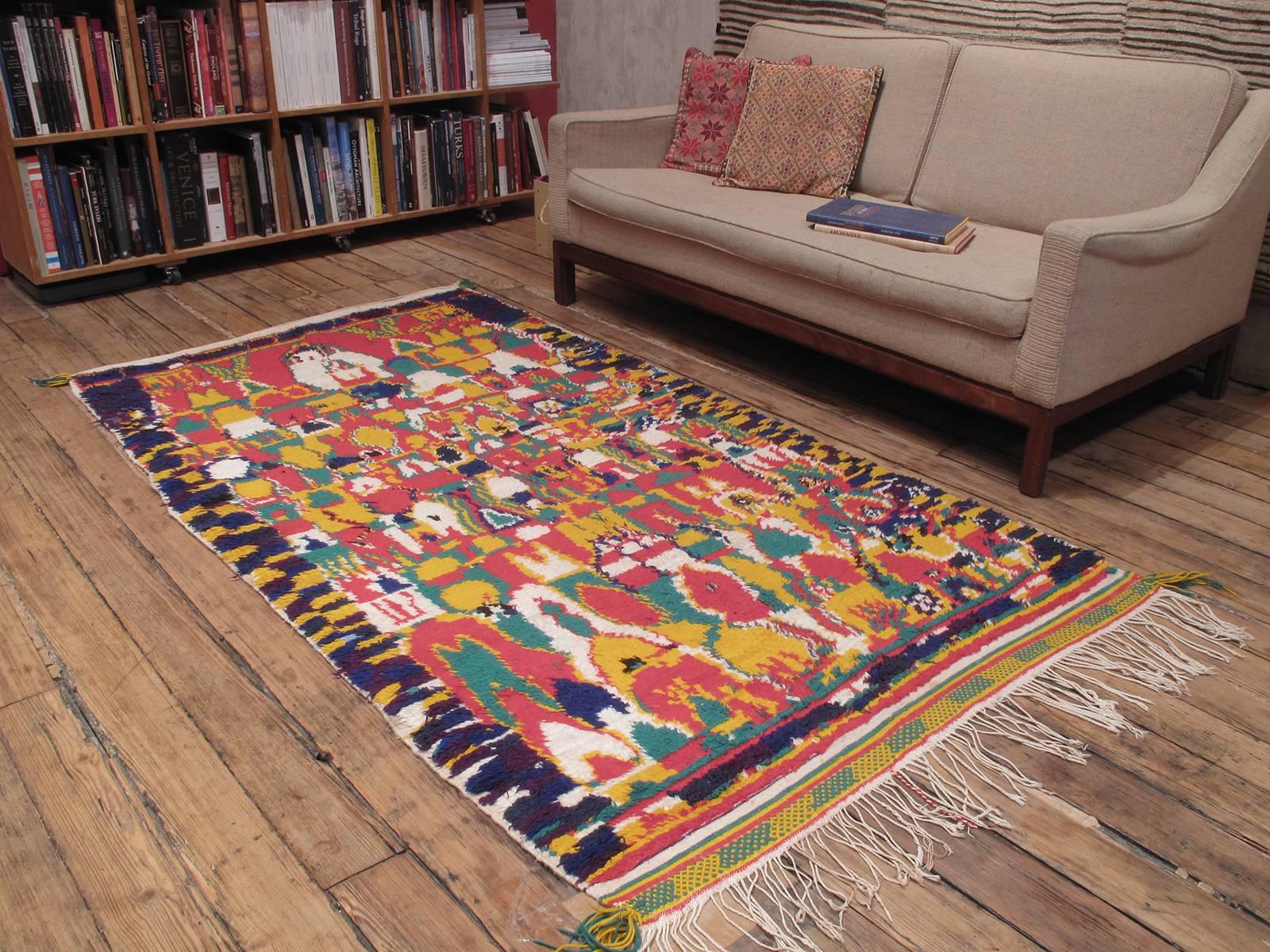 Azilal Moroccan Berber rug. A very cheerful example of Moroccan Berber weaving from the High Atlas Mountains, where authentic weaving traditions - as opposed to commercial weaving - survive to this day. Chaotic at first sight, it takes a while to