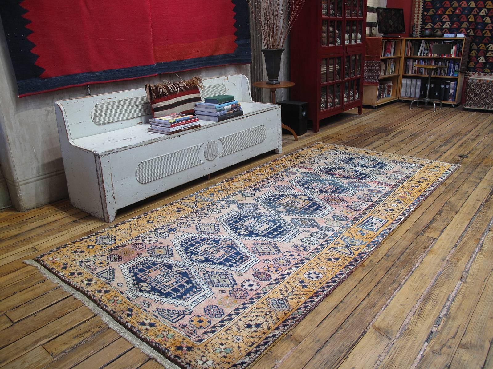 Kurdish rug. A lovely vintage Kurdish rug in the typical long format. Glossy wool, unusual color palette.